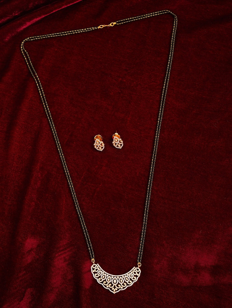 Classic Long Gold Plated American Diamond Mangalsutra Set with intricate pendant and matching earrings on red velvet