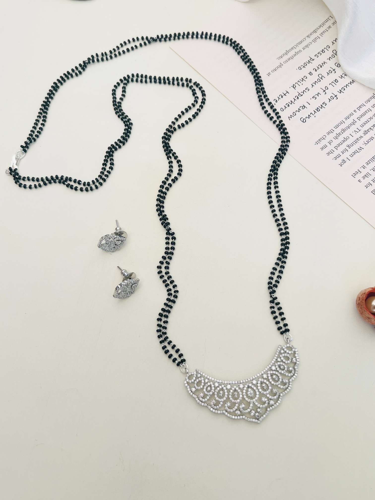 Classic Long Gold Plated American Diamond Mangalsutra Set with intricate pendant and matching earrings