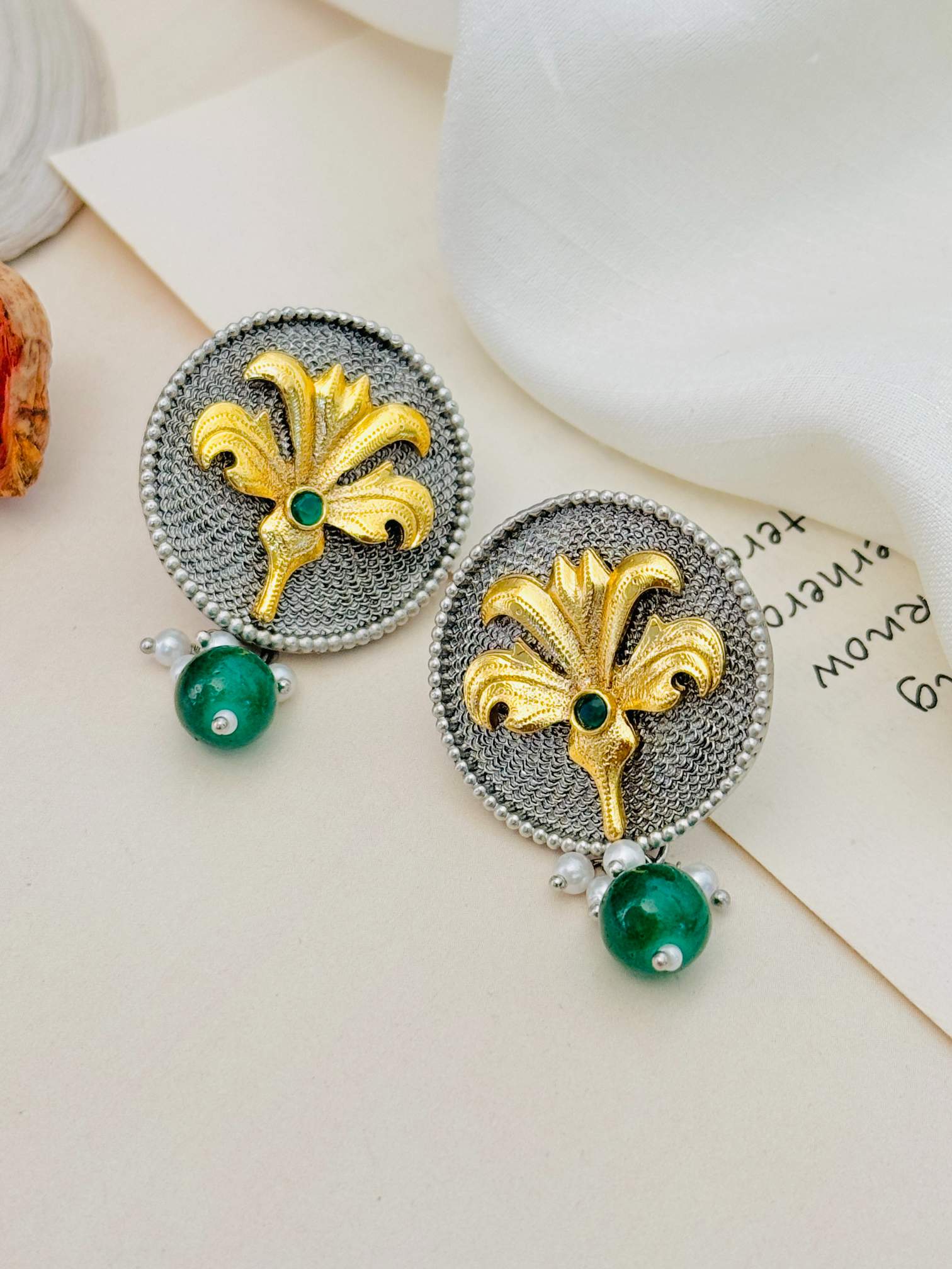 Dual Plating Oxidised Round Stud Earring with gold floral design and green bead by Abdesignsjewellery