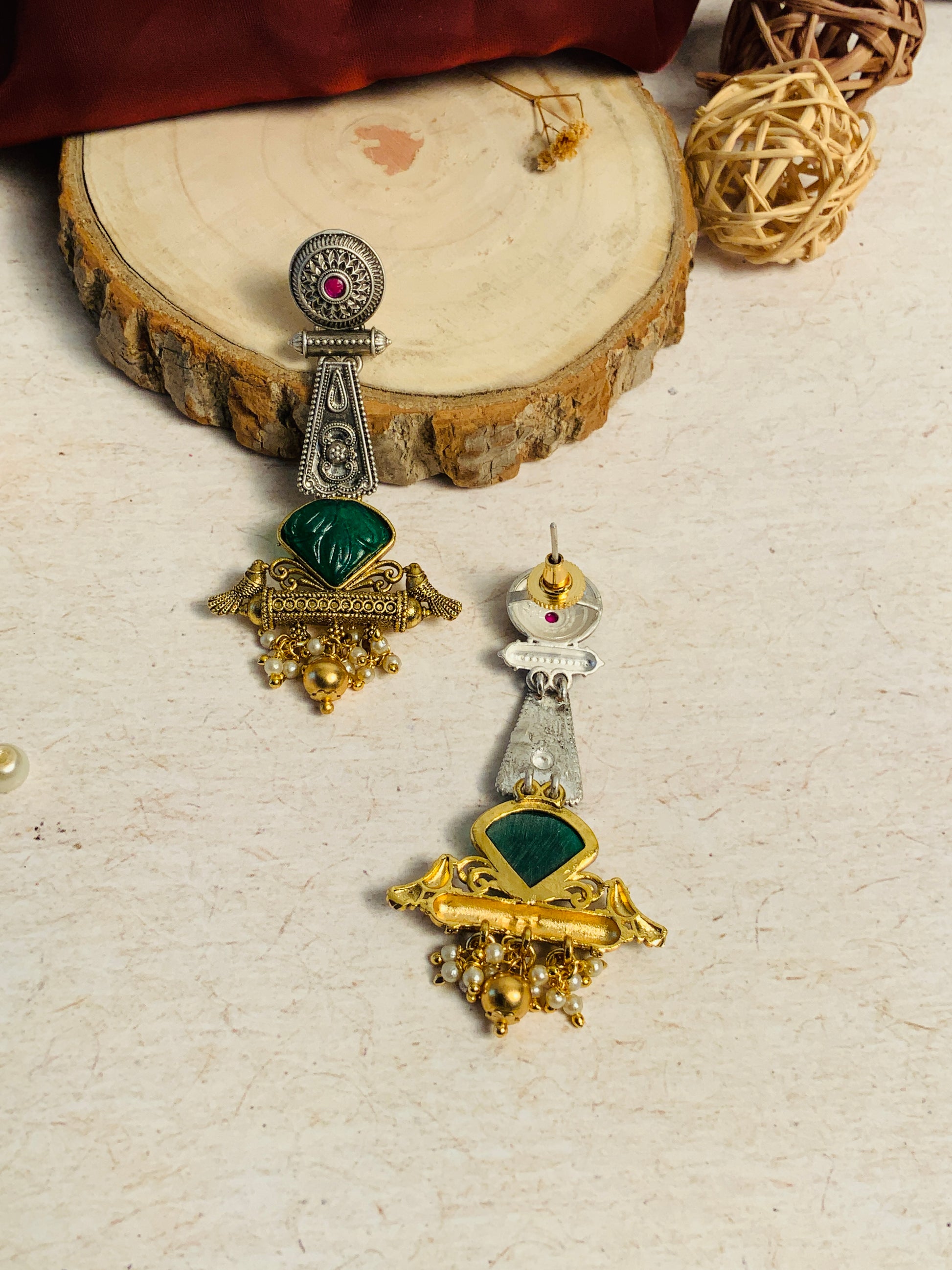 Dual Tone Bird Stone Earrings by Abdesignsjewellery with intricate silver and gold detailing and green stone accents