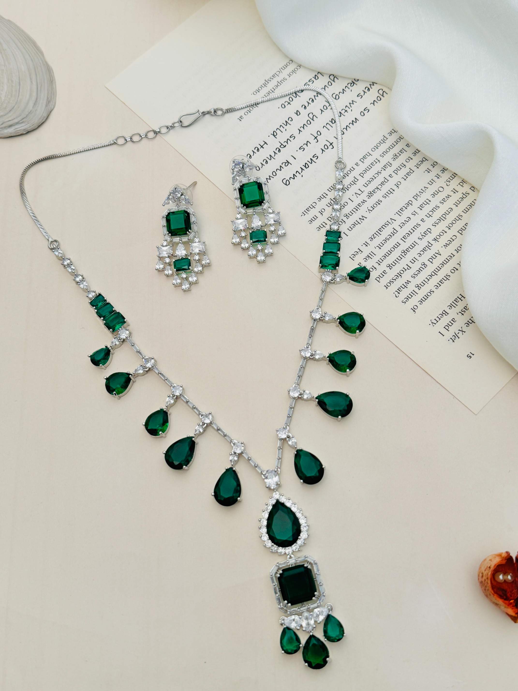 Emerald American Diamond Necklace Set featuring green teardrop stones and matching earrings by Abdesignsjewellery
