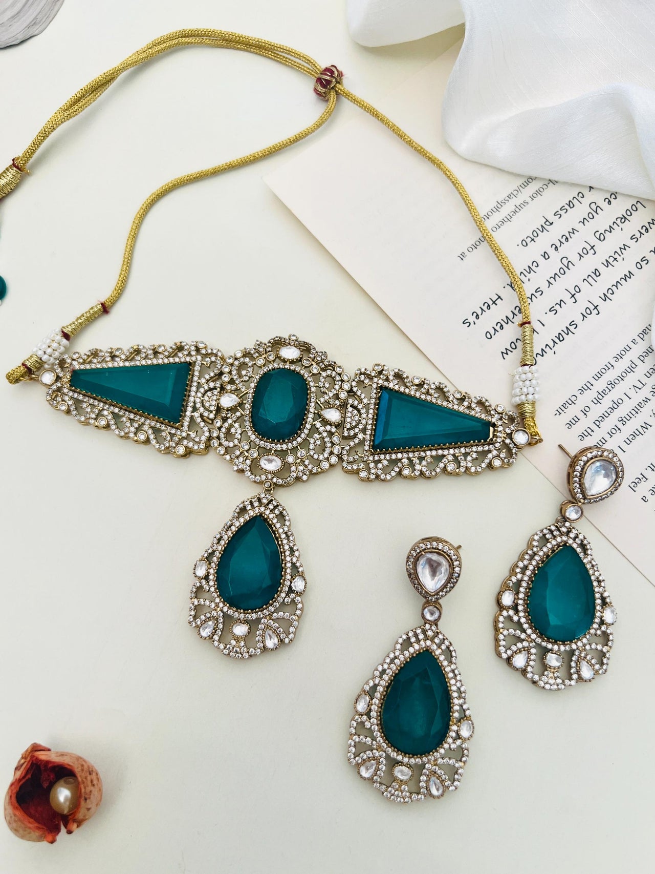 Emerald Gold Plated Necklace Choker Set with intricate green stones and pearl detailing by Abdesignsjewellery