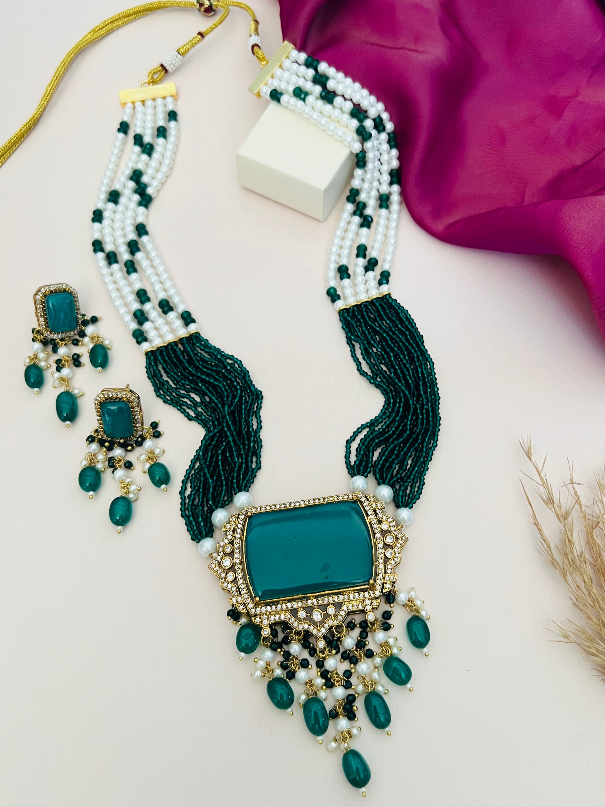 Emerald Green Stones Bridal Necklace Set with multi-strand white and green beads and matching earrings
