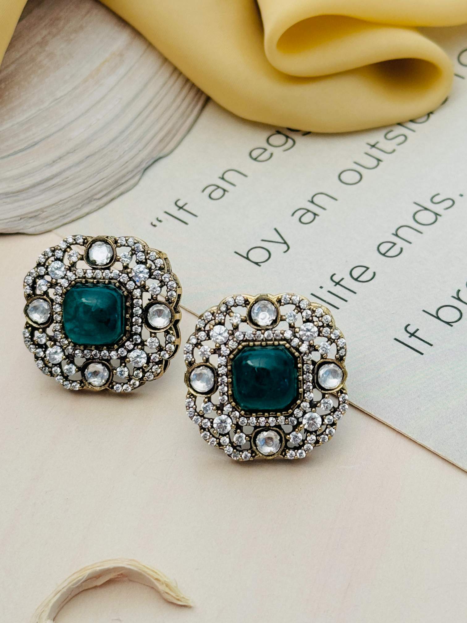 Abdesignsjewellery Emerald Polki Diamond Stud Earring with green center stone and sparkling diamond halo