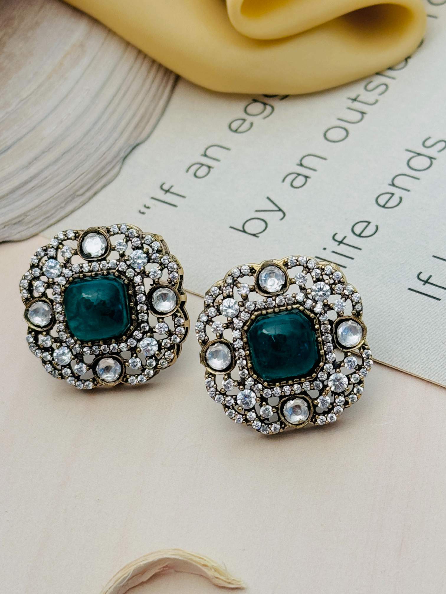 Abdesignsjewellery Emerald Polki Diamond Stud Earring with green center stone and surrounding clear diamonds