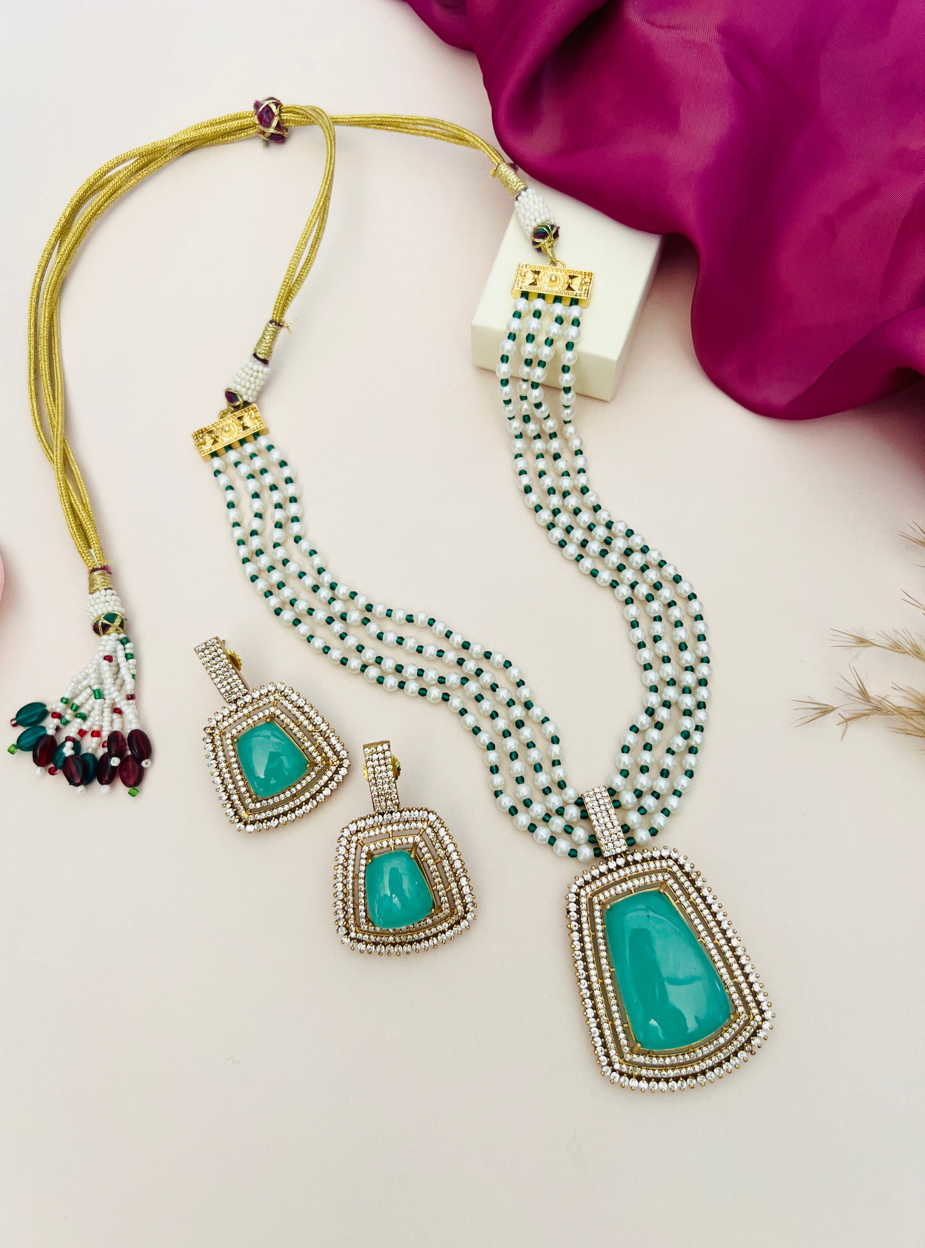 Emerald Stone Sabyasachi Necklace Set by Abdesignsjewellery with green stones and beadwork