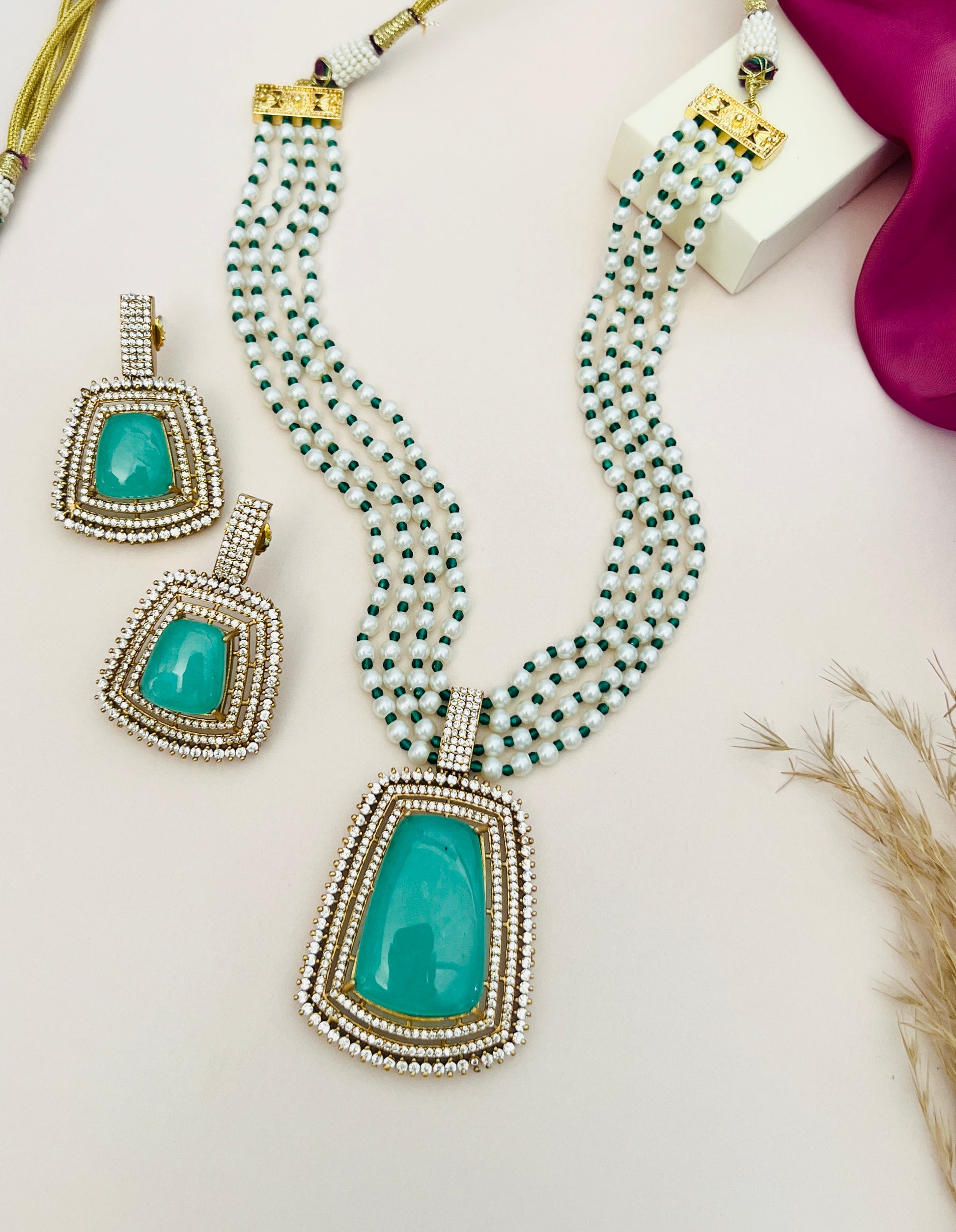 Emerald Stone Sabyasachi Necklace Set by Abdesignsjewellery with green stones and intricate beadwork