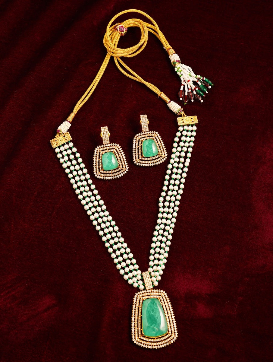 Emerald Stone Sabyasachi Necklace Set by Abdesignsjewellery with green stones and pearl beads