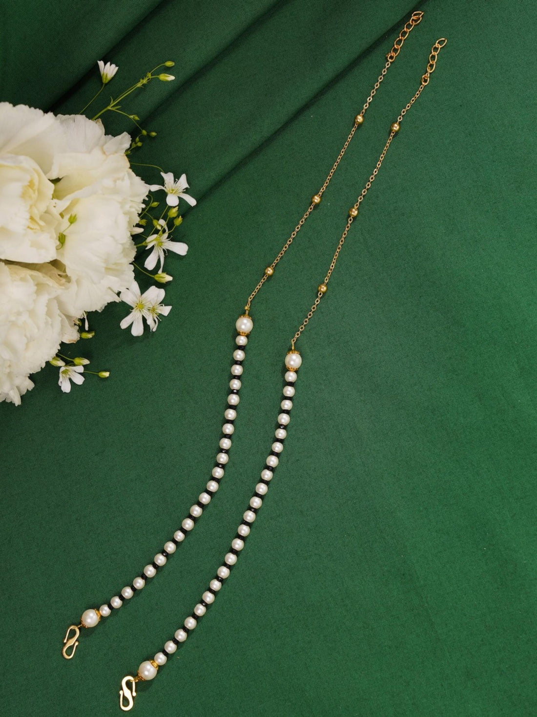 Ethnic Gold Plated Pearls Foot Anklets worn on both feet showcasing delicate pearl design by Abdesignsjewellery