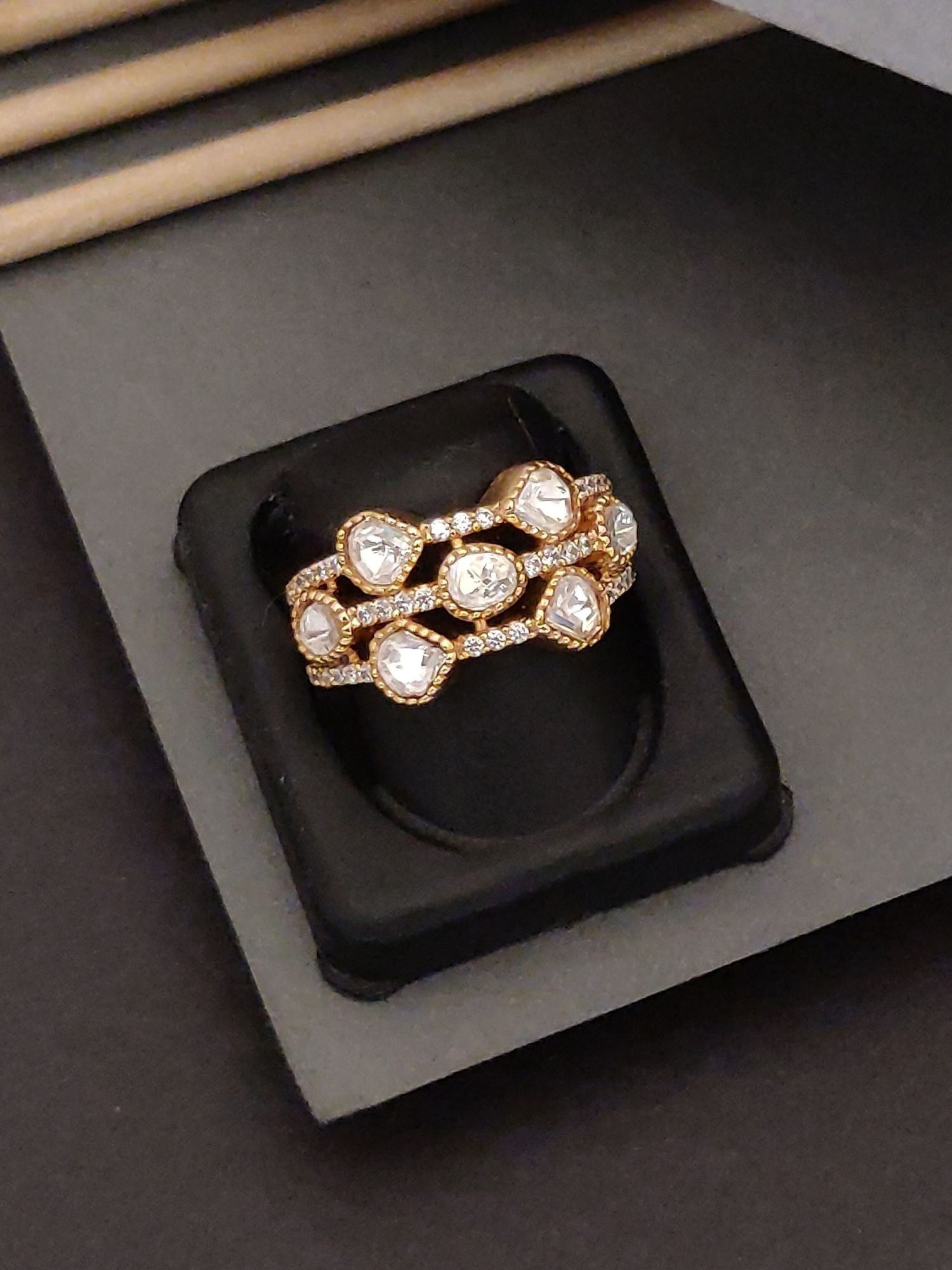 Exquisite Gold Plated Polki Ring with sparkling stones on black display by Abdesignsjewellery