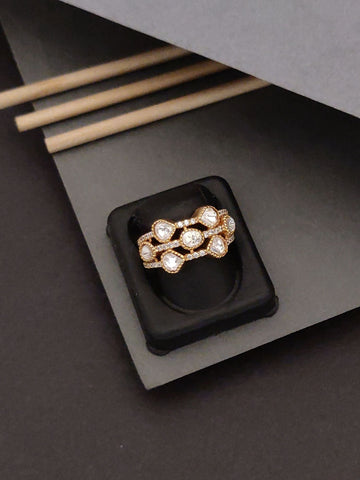 Exquisite Gold Plated Polki Ring with sparkling stones displayed on a black jewelry holder