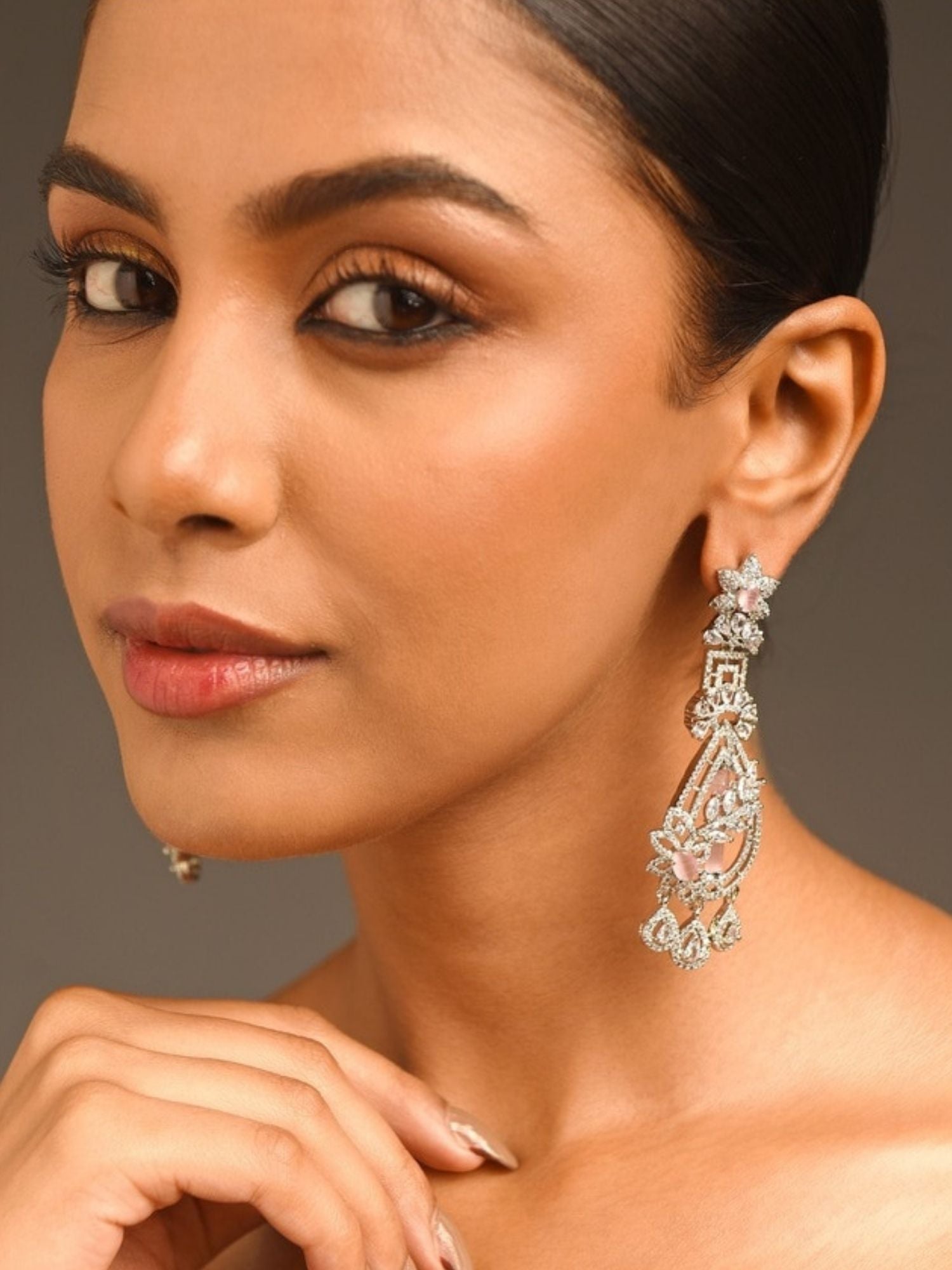 Fascinating Silver Plated Pink American Diamond Earring worn by model showcasing intricate design