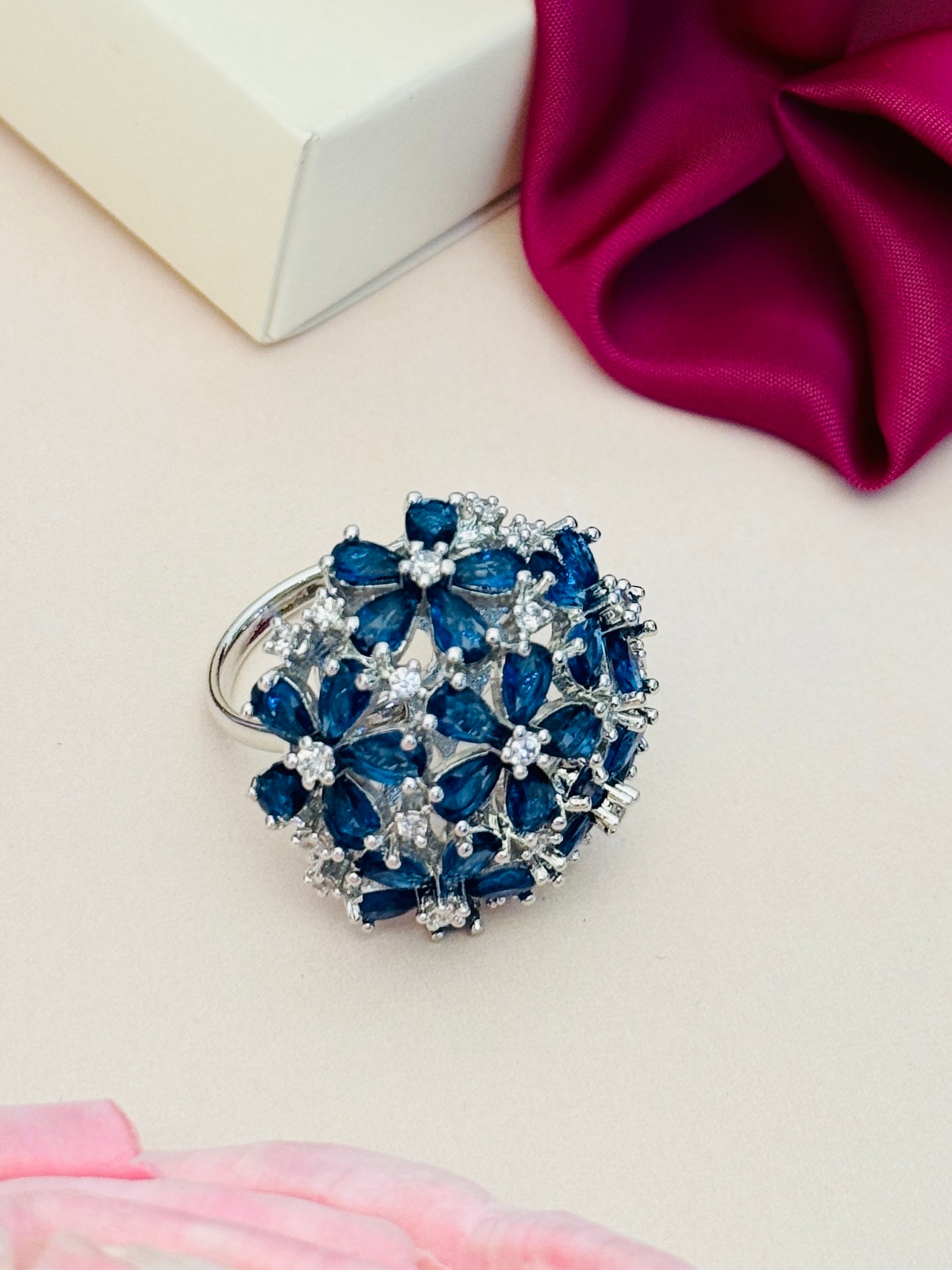 Floral Silver Plated Zircon Cocktail Party Ring with blue flower design and sparkling stones by Abdesignsjewellery