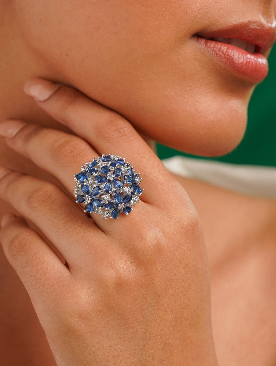 Floral Silver Plated Zircon Cocktail Party Ring with blue stones worn on hand