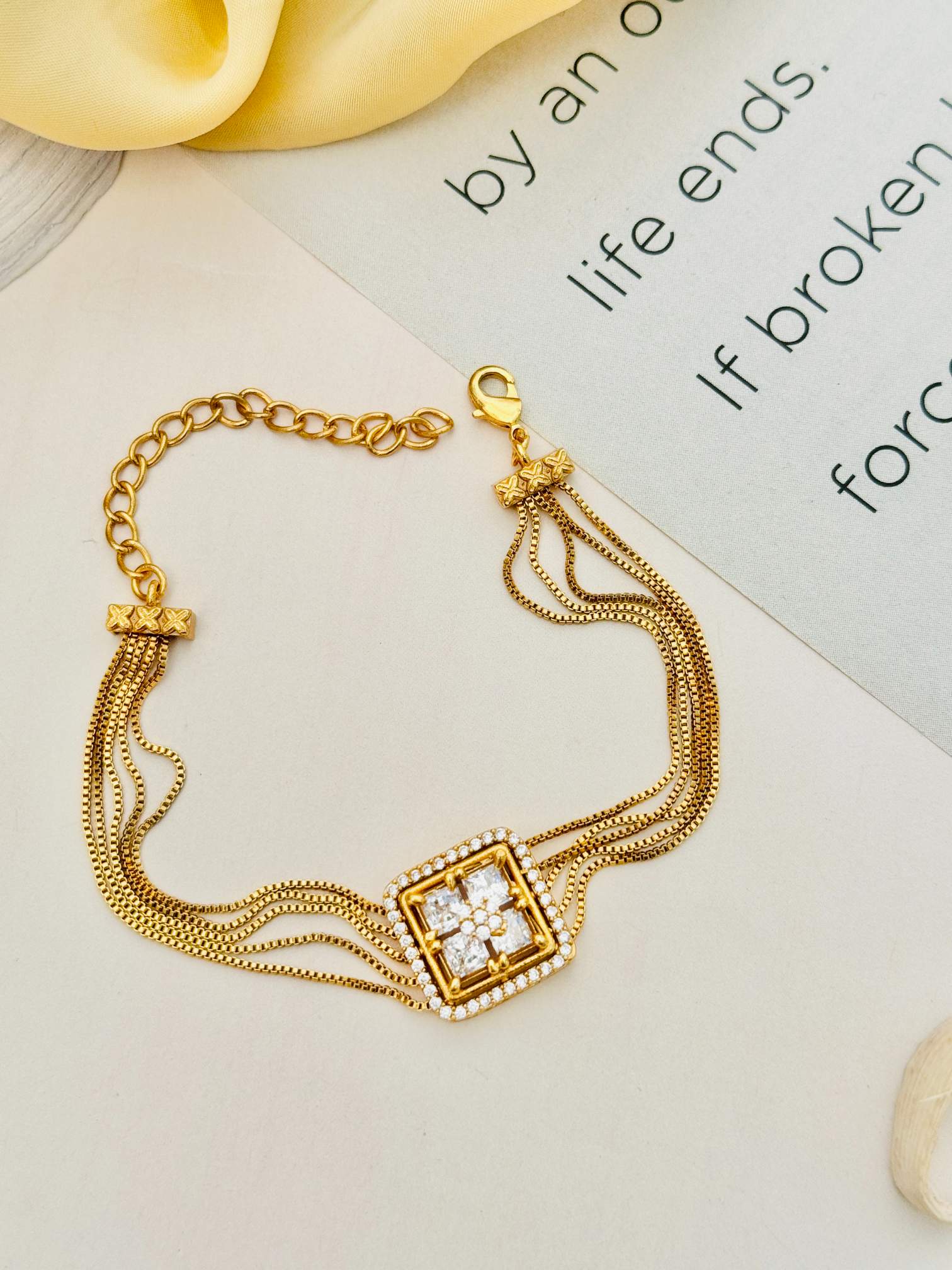 Gold Plated American Diamond Hand Bracelet by Abdesignsjewellery with multi-chain design and square centerpiece