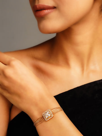 Gold Plated American Diamond Hand Bracelet by Abdesignsjewellery worn on wrist with elegant black outfit