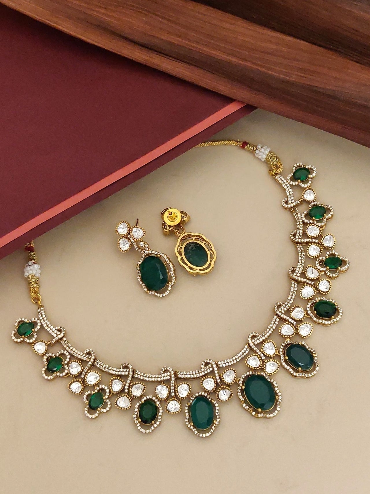 Gold Plated American Diamond Necklace Set with green gems and matching earrings for elegant occasions