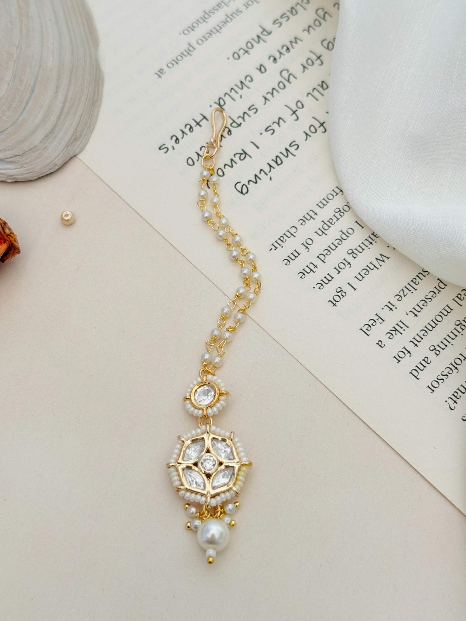 Gold Plated Kundan Maangtikka with intricate white stones and pearl details by Abdesignsjewellery
