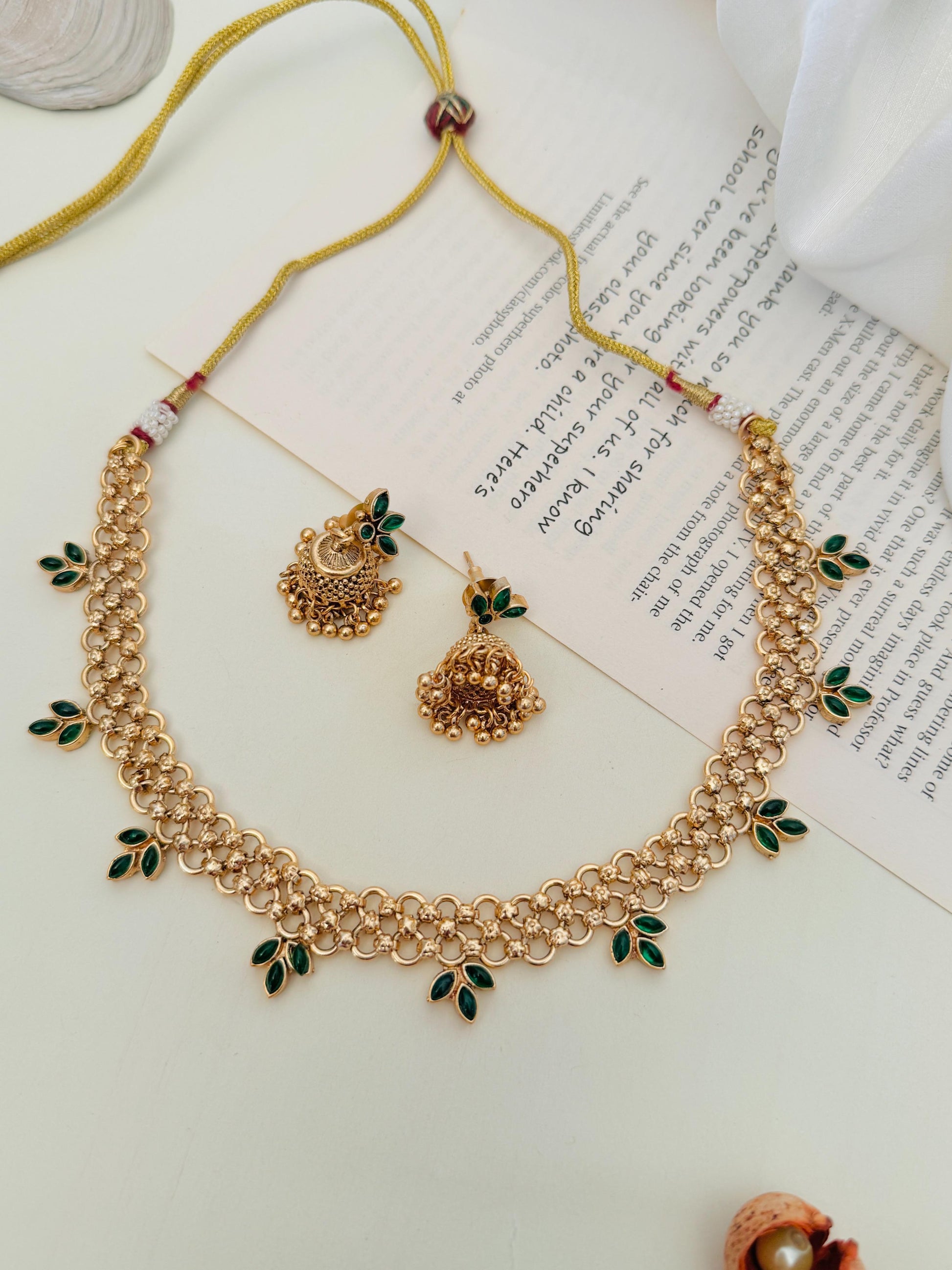 Gold Plated Matt Finish Necklace Set by Abdesignsjewellery with intricate floral design and green leaf accents
