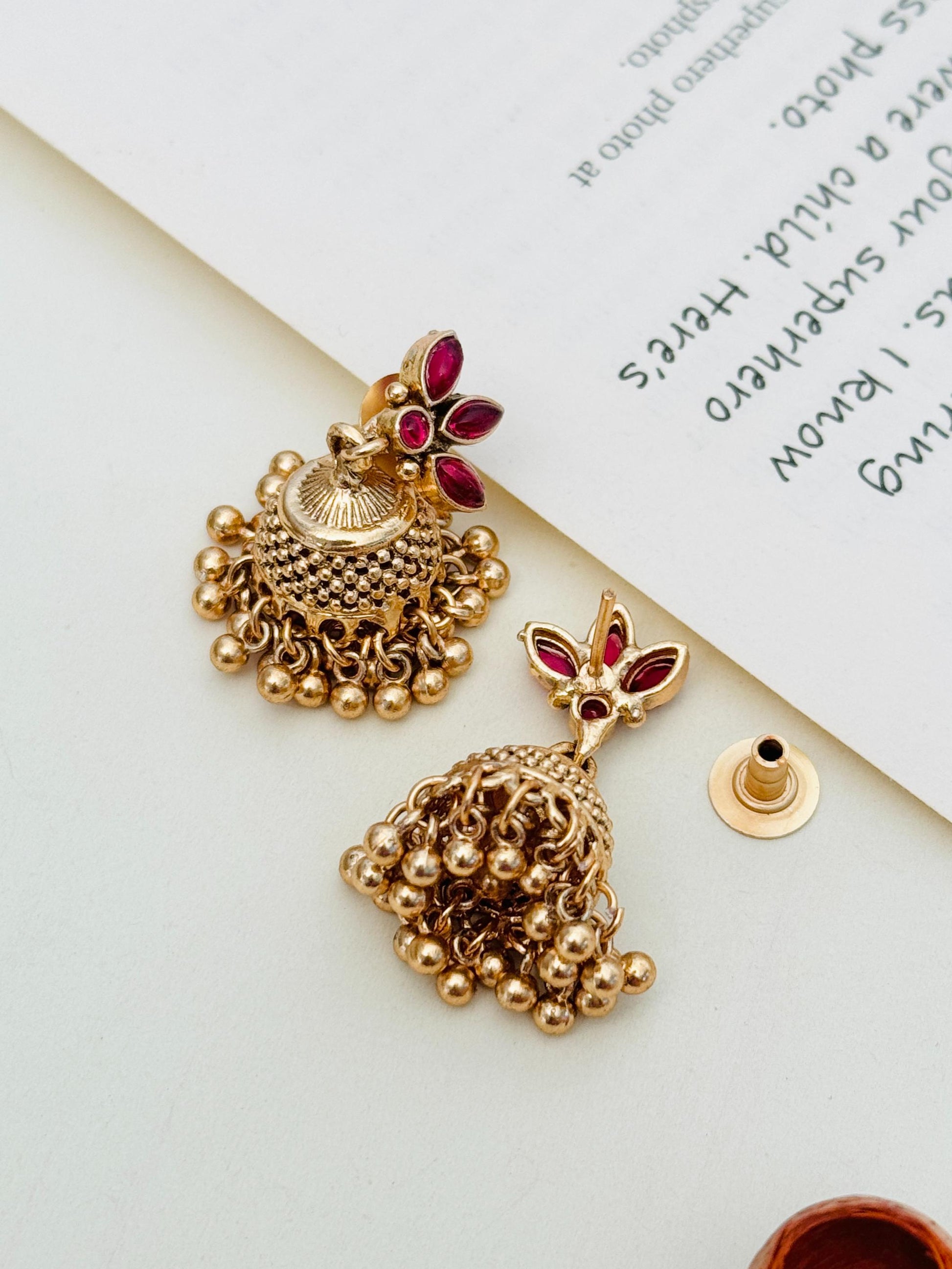 Abdesignsjewellery Gold Plated Matt Finish Necklace Set featuring intricate gold earrings with red stone accents