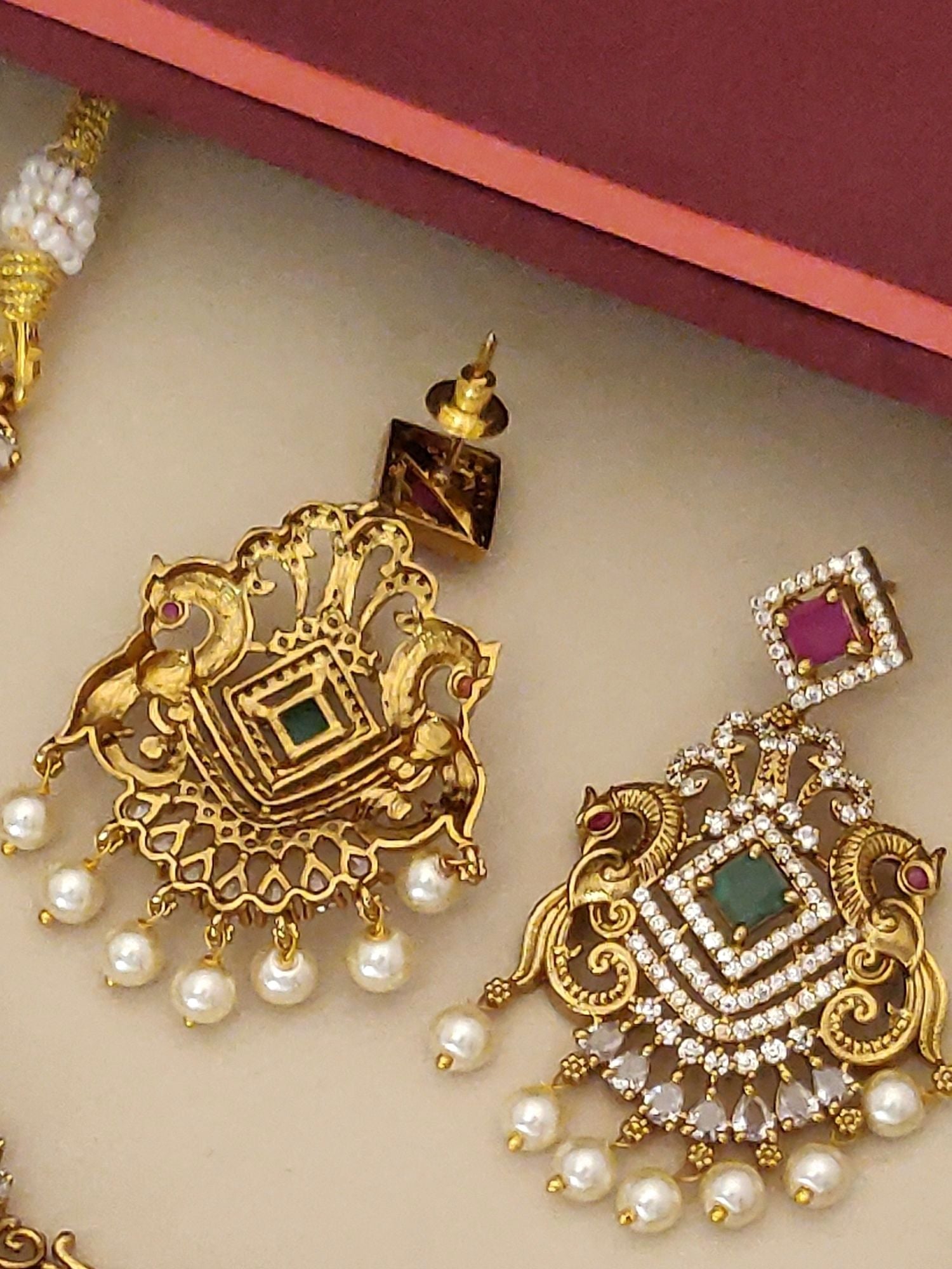 Gold plated multicolour diamond necklace set featuring intricate design with pearl accents