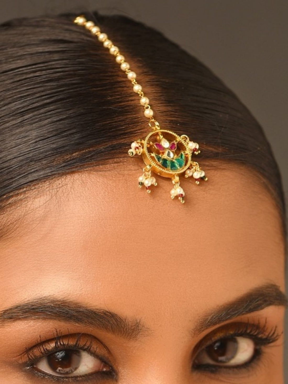 Gold Plated Paachi Kundan Maangtikka worn by woman with sleek hair and natural makeup by Abdesignsjewellery
