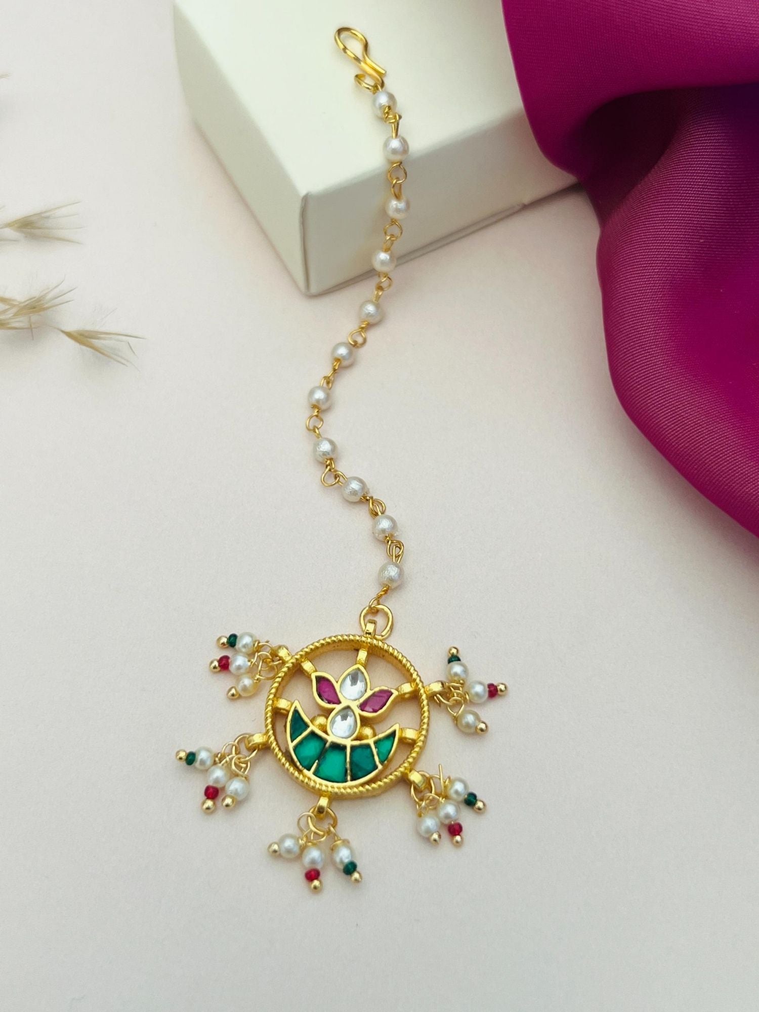 Gold Plated Paachi Kundan Maangtikka with green and pink stones and pearl embellishments by Abdesignsjewellery