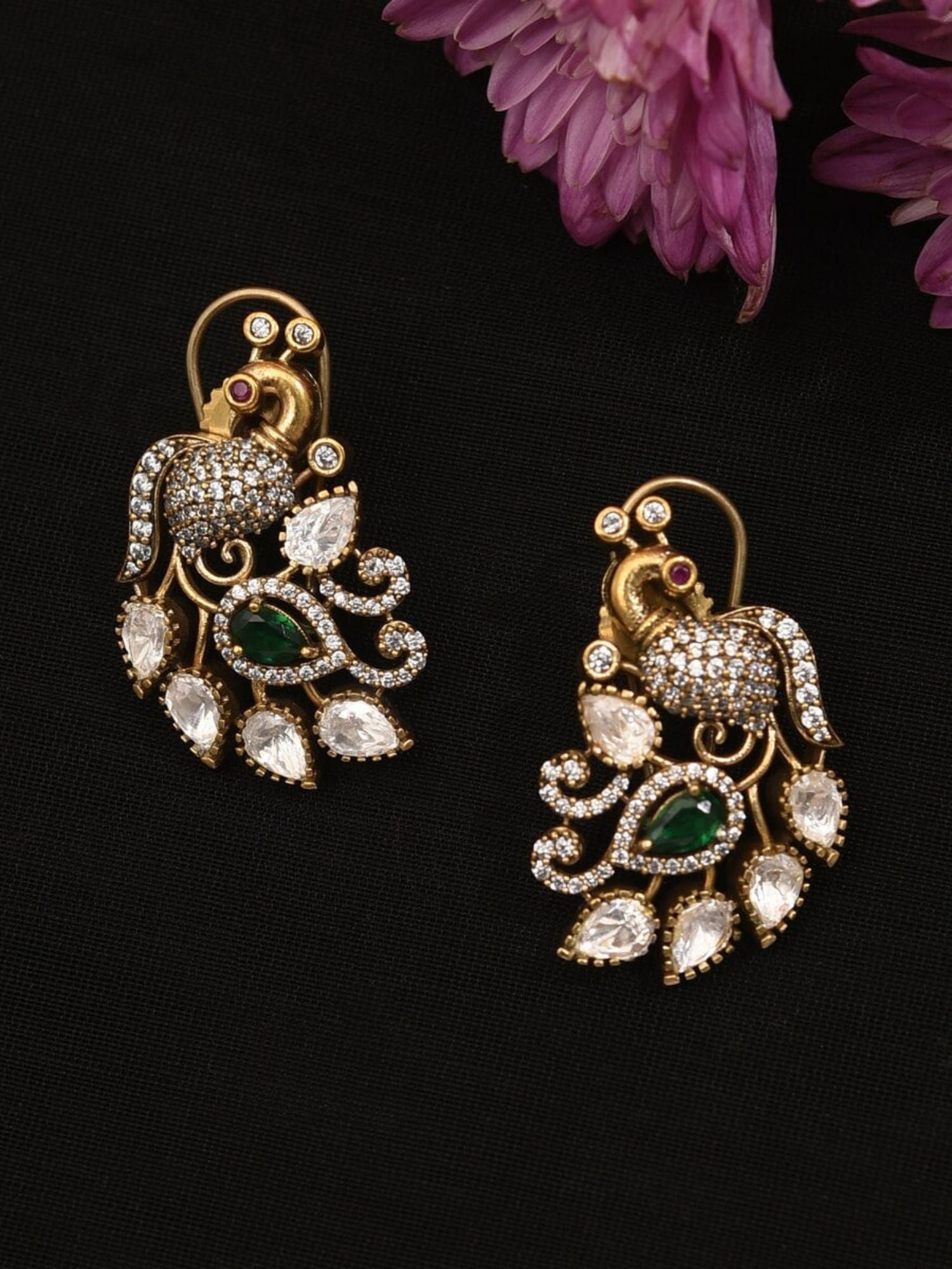 Gold Plated Peacock Polki Stud Earring with intricate white and green stone detailing on black background