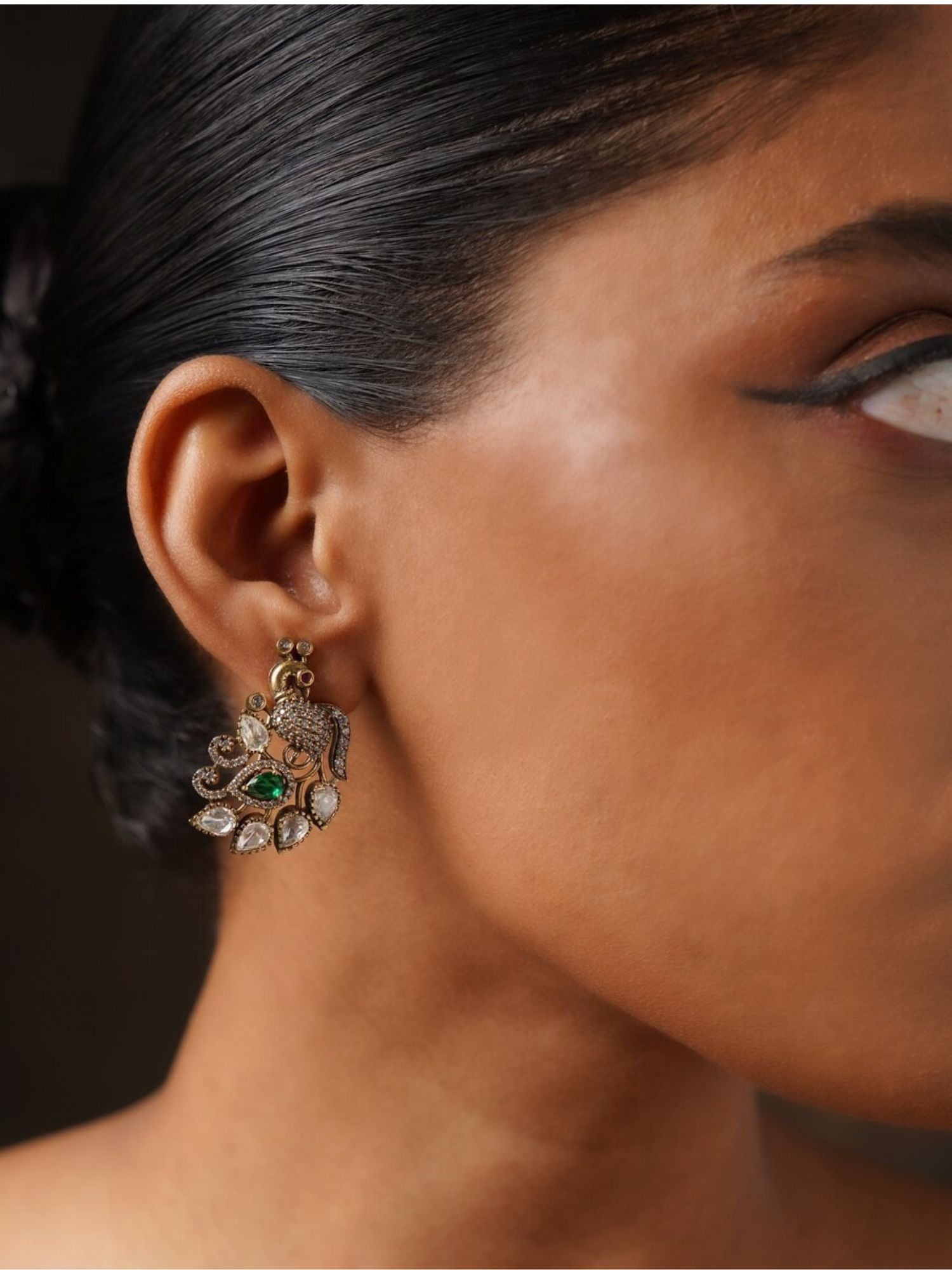 Gold Plated Peacock Polki Stud Earring worn on a woman’s ear from Abdesignsjewellery