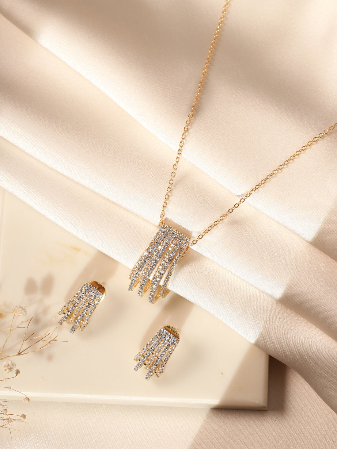 Gold Plated Pendant Chain Set worn by woman with elegant layered pendant and matching earrings