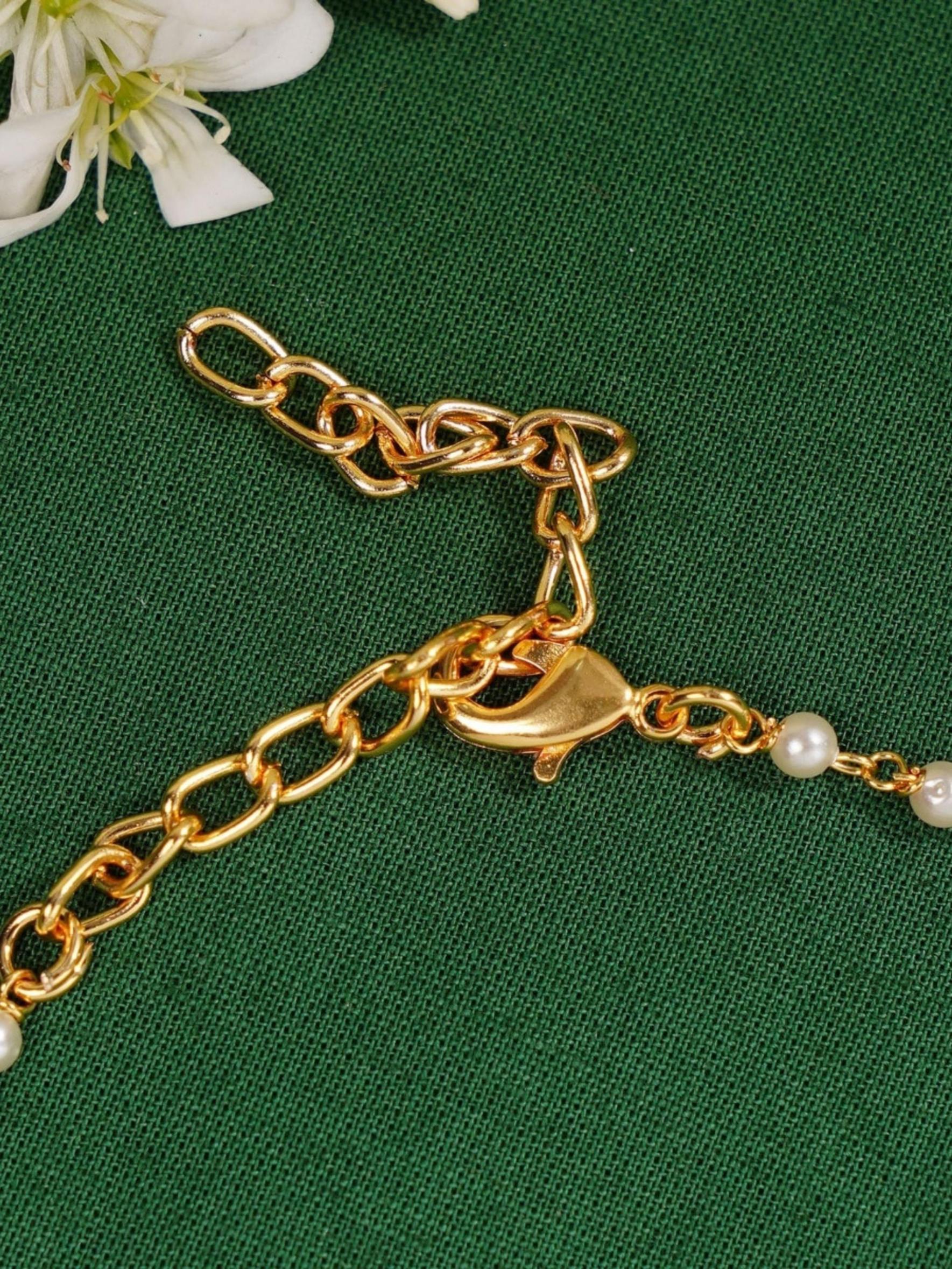 Gold Plated Polki Hand Bracelet chain and lobster clasp details by Abdesignsjewellery on green fabric background