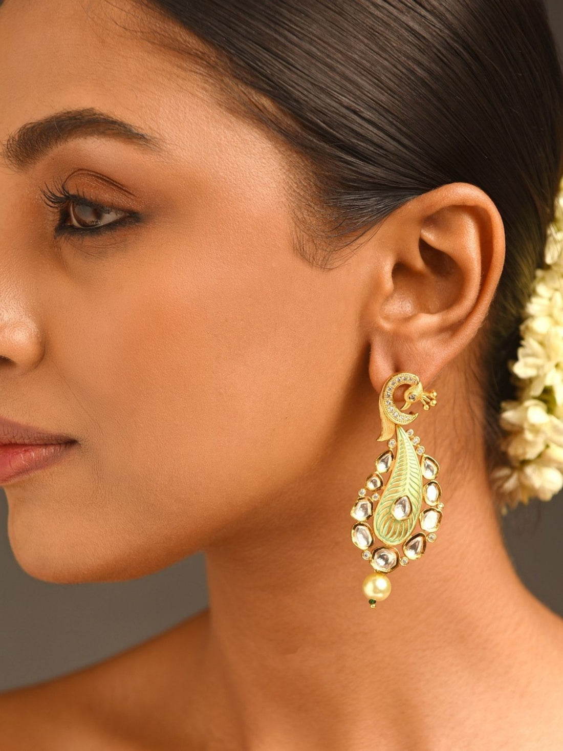 Gold Plated Polki Kundan Earrings worn on woman showcasing intricate traditional design