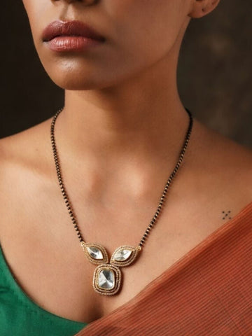 Gold Plated Polki Mangalsutra with traditional design worn on neck by woman