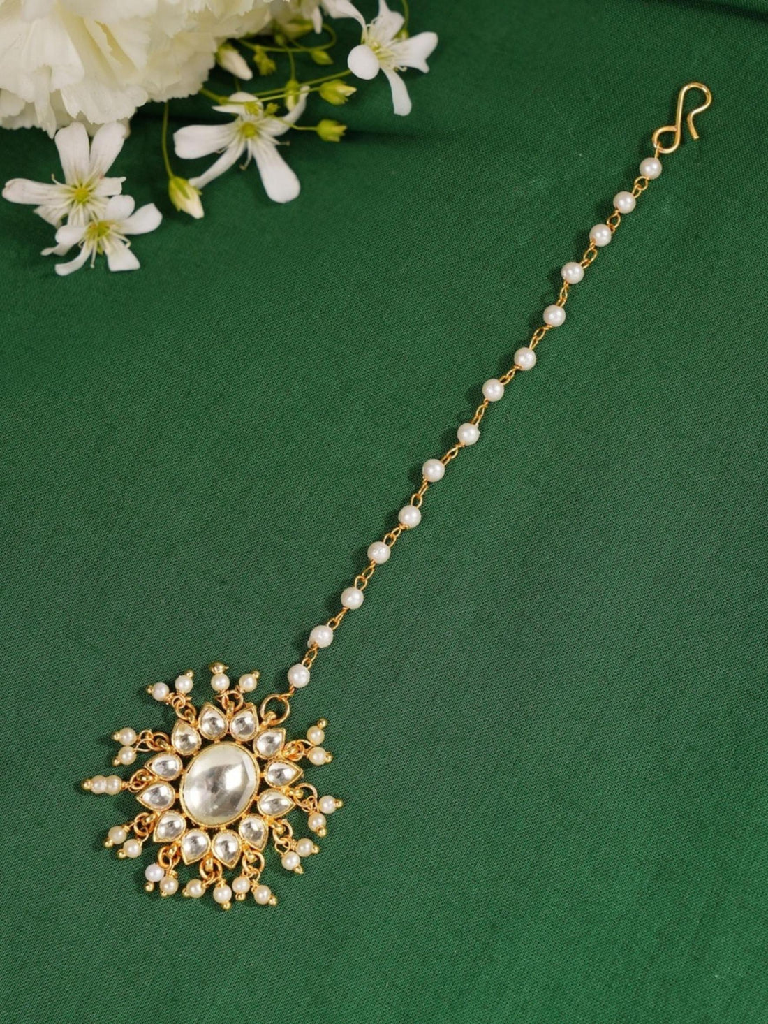 Gold Plated Polki Paachi Kundan Maangtikka worn on forehead by woman with sleek hair