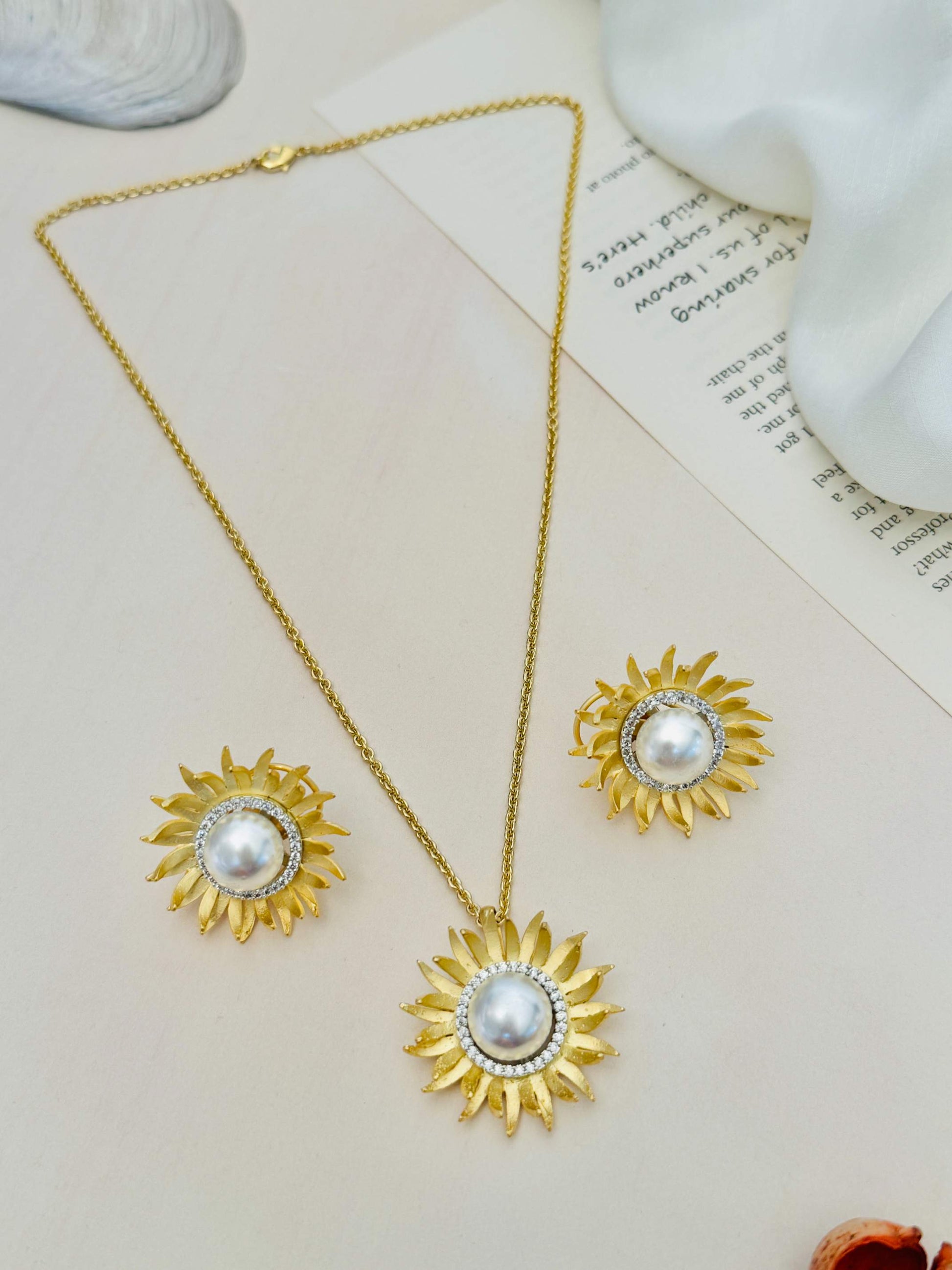 Gold Plated Polki Pendant Chain Set featuring a sunburst design with pearl center and gold tone finish