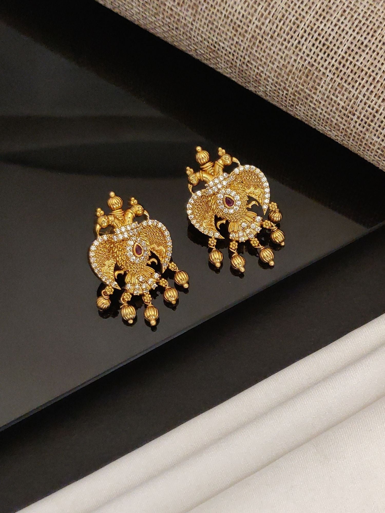 Gold Traditional Southindian Birds Earrings with intricate design and dangling small beads
