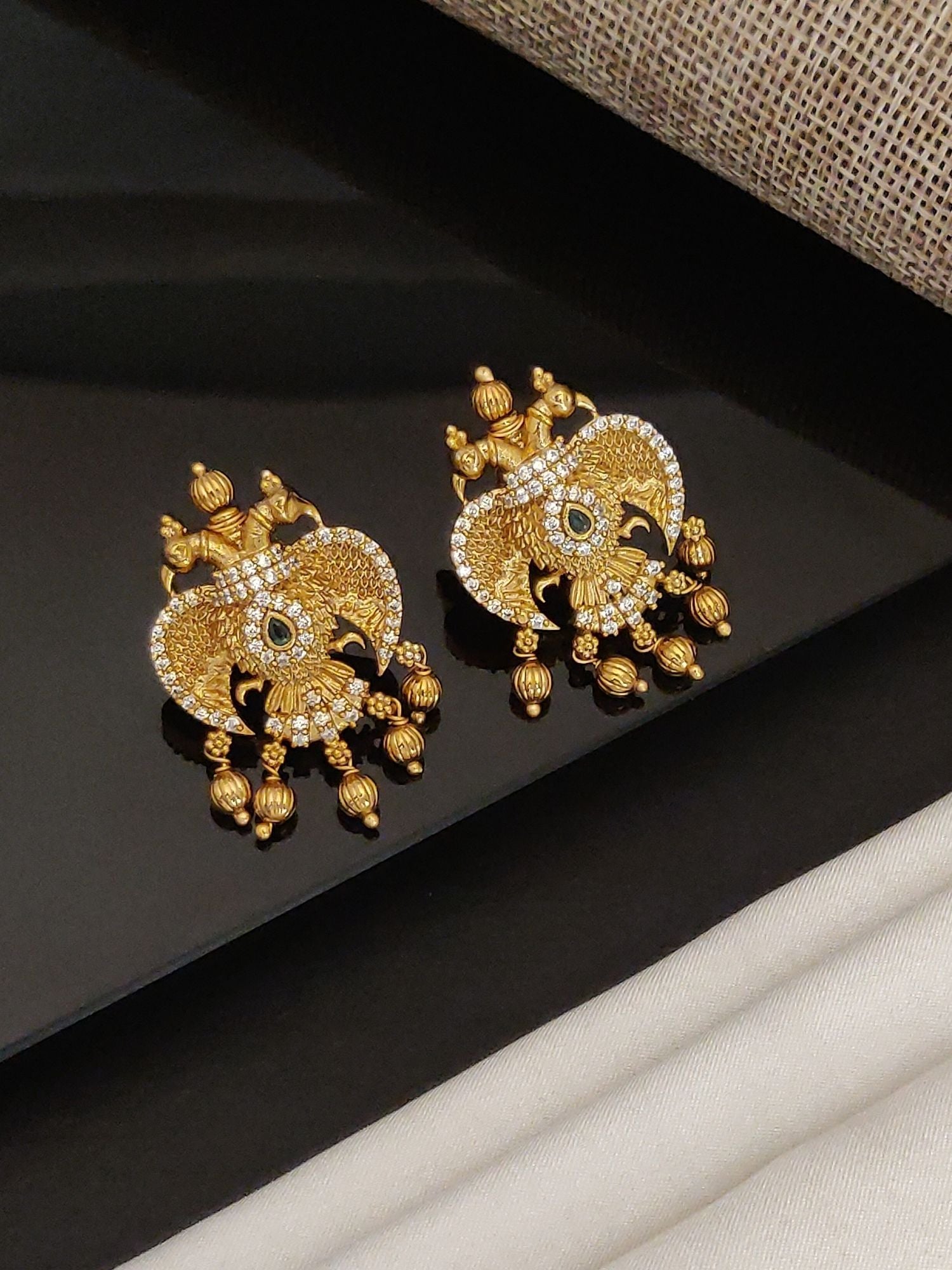 Gold Traditional Southindian Birds Earrings with intricate design and hanging beads by Abdesignsjewellery