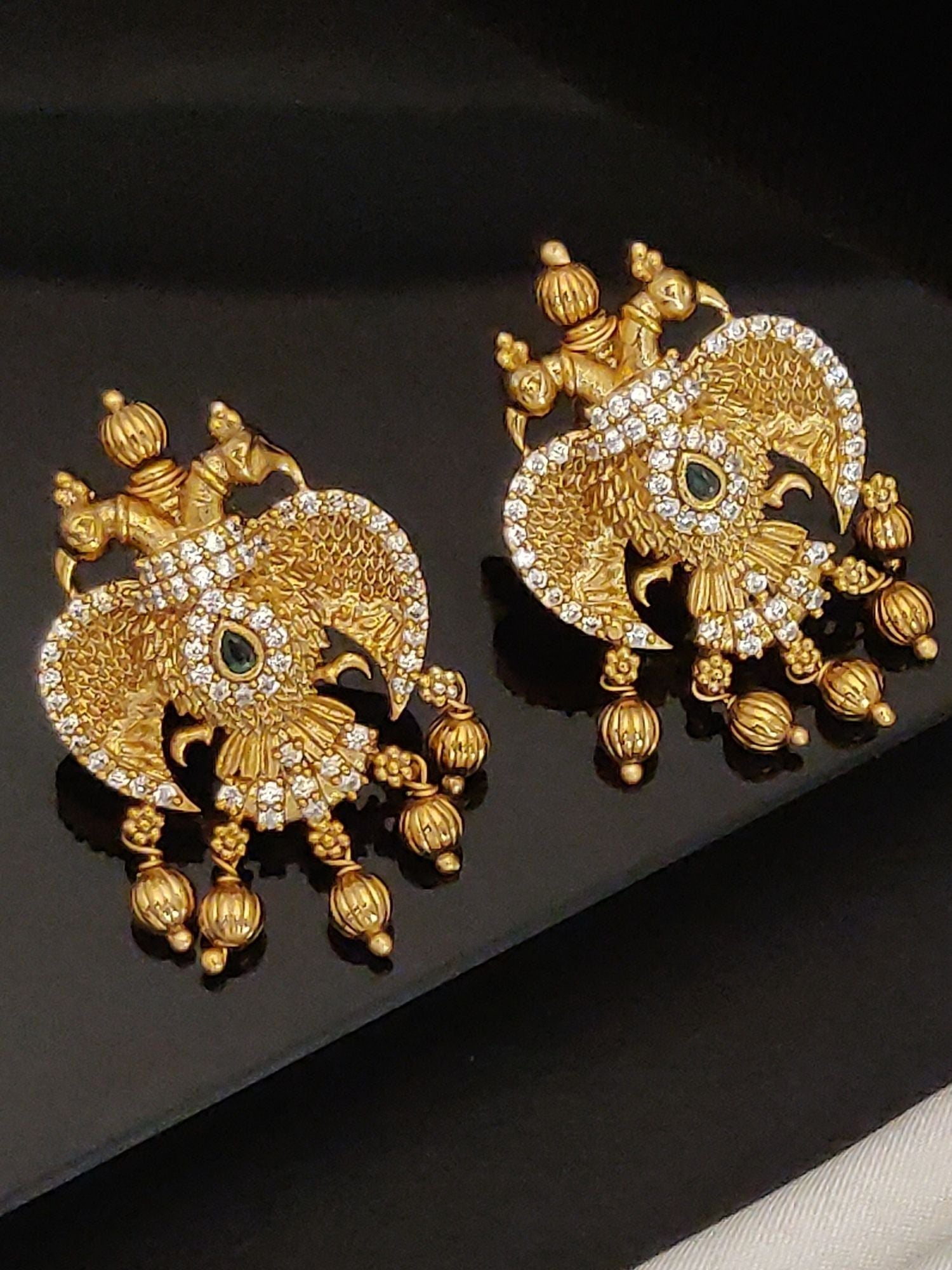 Gold Traditional Southindian Birds Earrings with intricate design and studded stones by Abdesignsjewellery