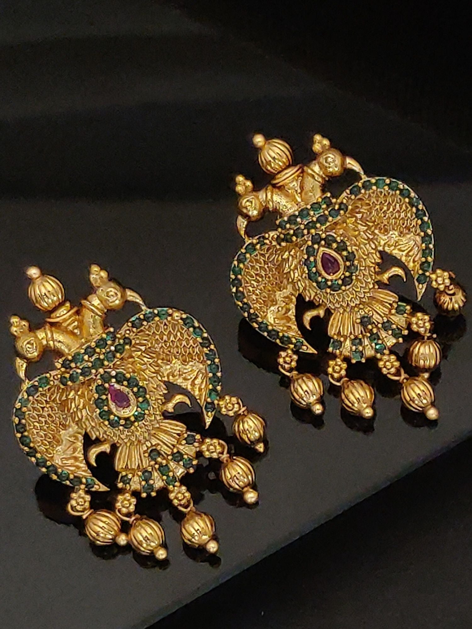 Gold Traditional Southindian Birds Earrings with intricate green and purple stone detailing from Abdesignsjewellery