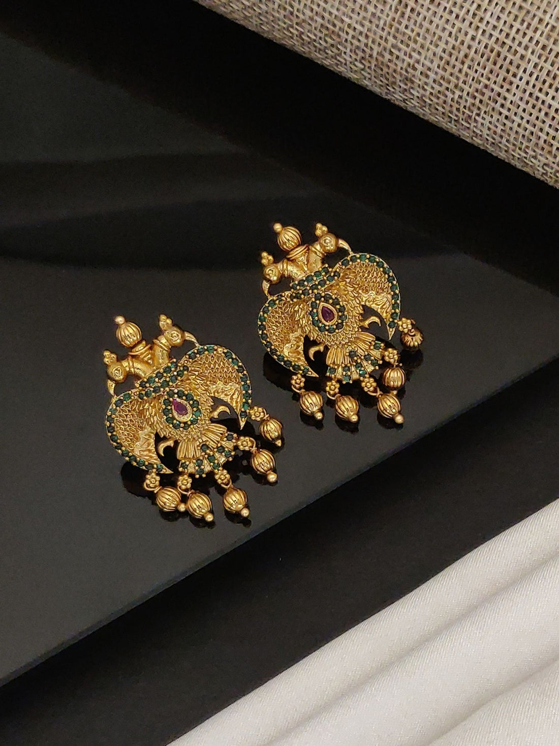 Gold Traditional Southindian Birds Earrings with intricate design and dangling beads by Abdesignsjewellery
