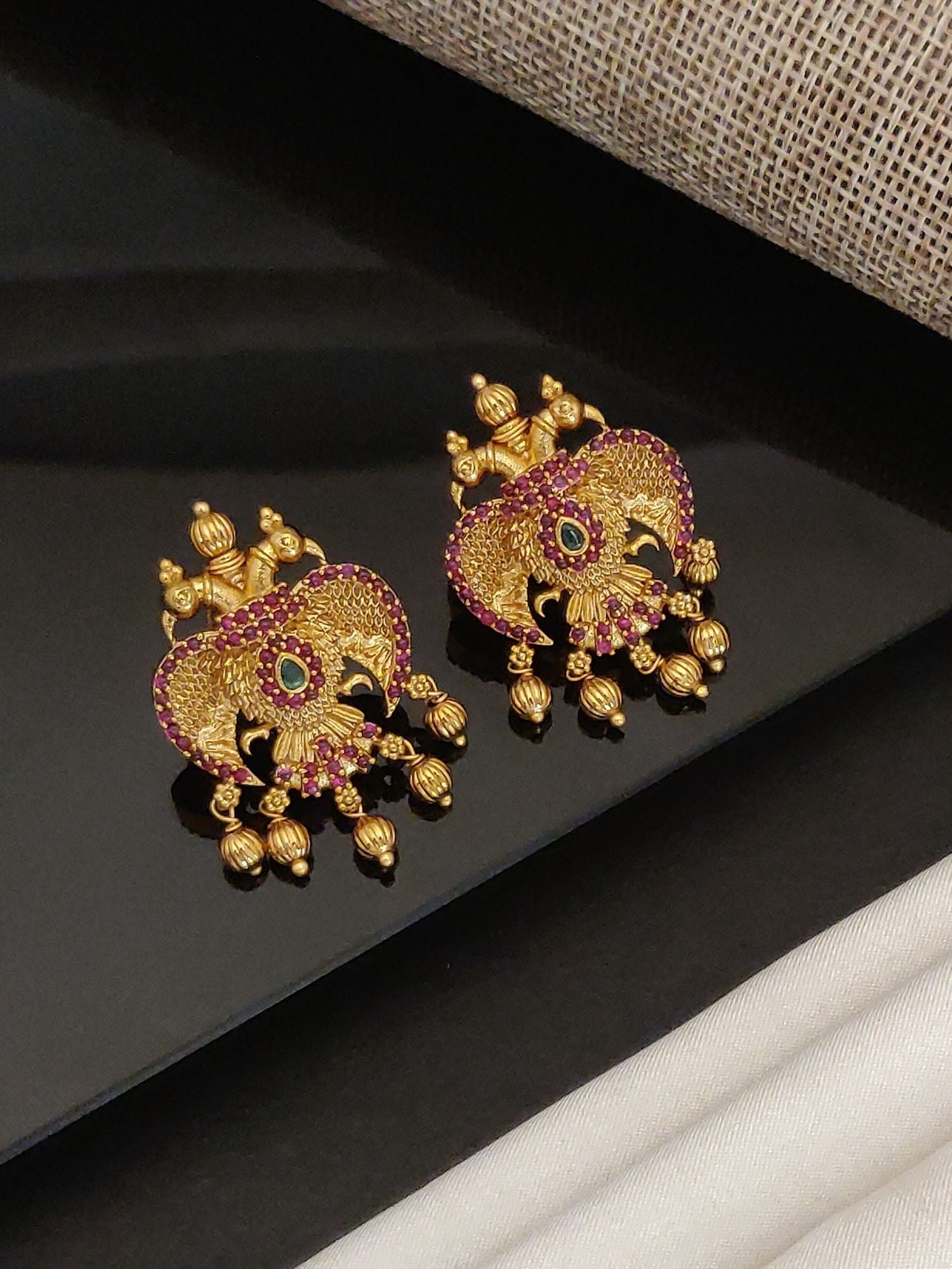 Gold Traditional Southindian Birds Earrings with intricate design and red gemstones by Abdesignsjewellery