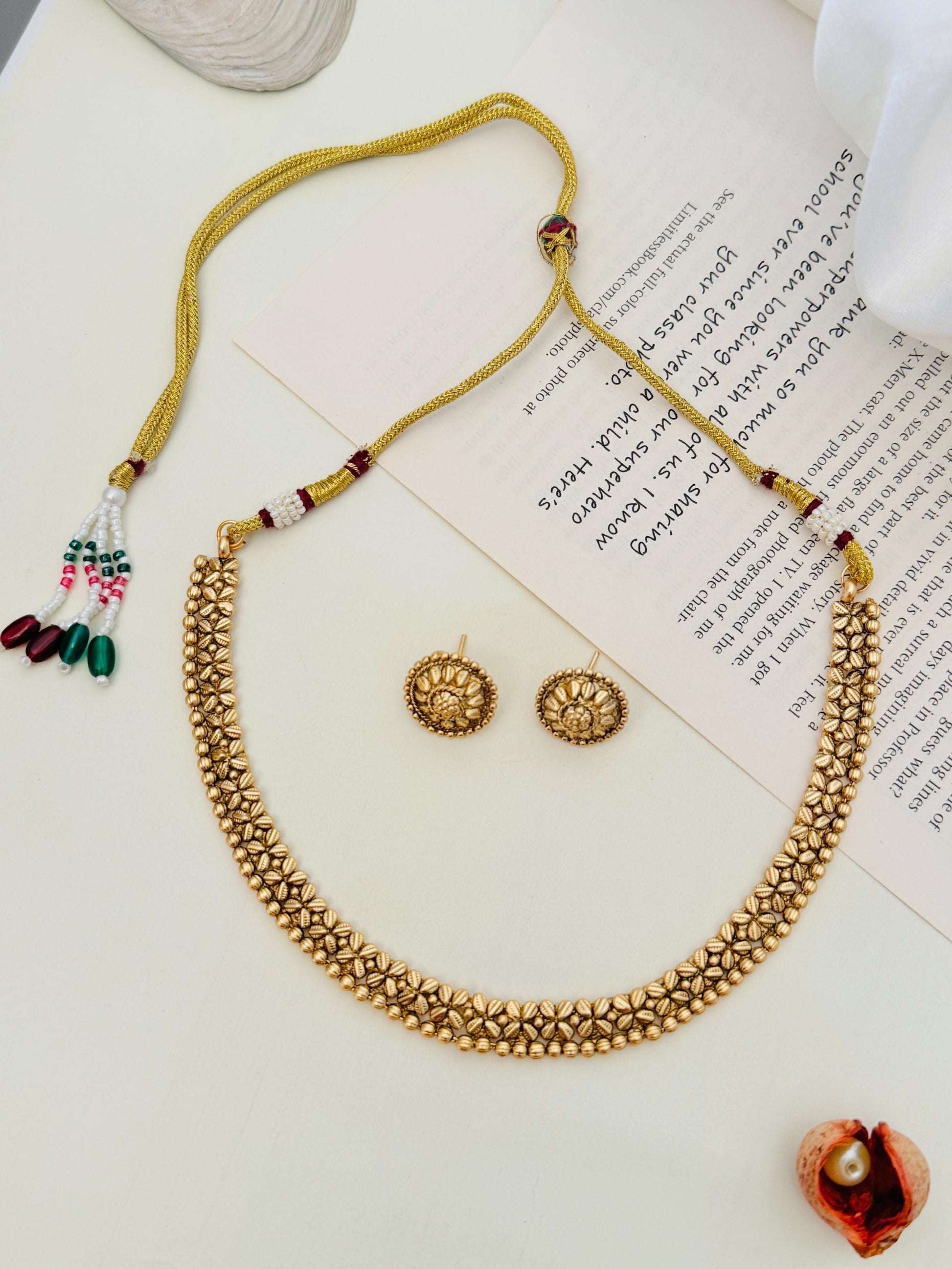 Golden Plated Matt Finish Necklace Set by Abdesignsjewellery with intricate floral design and matching earrings
