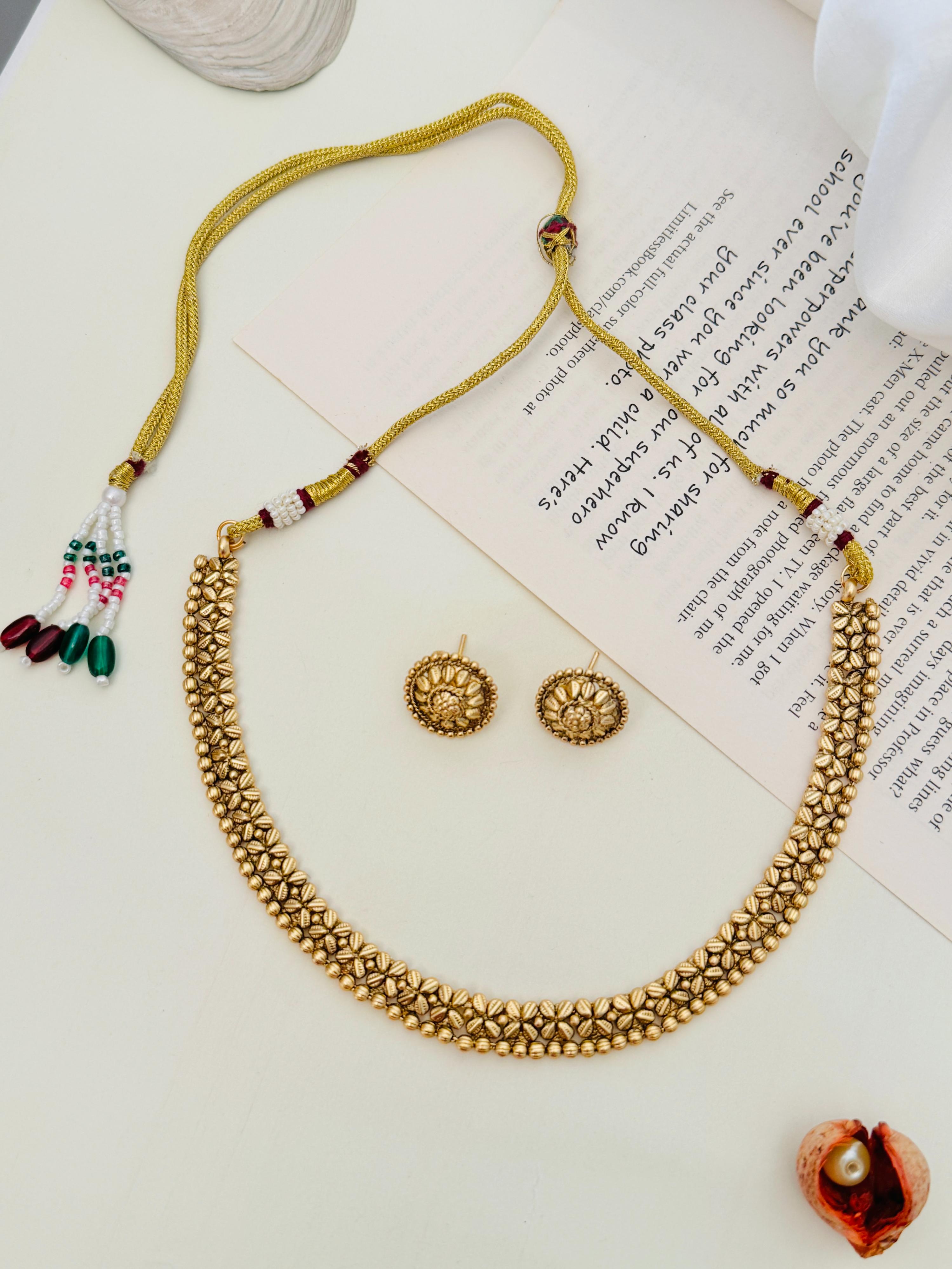 Golden Plated Matt Finish Necklace Set by Abdesignsjewellery with intricate floral design and matching earrings