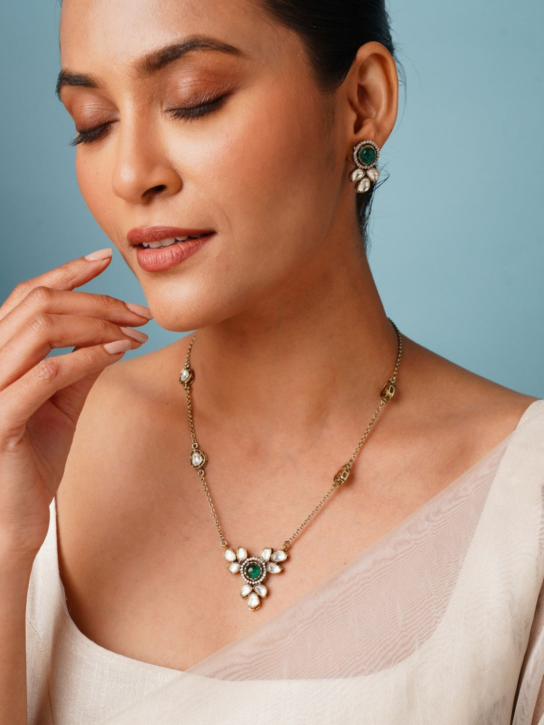 Green Emerald Statement Oxidsed Gold Polki Necklace Set by Abdesignsjewellery worn by woman with matching earrings