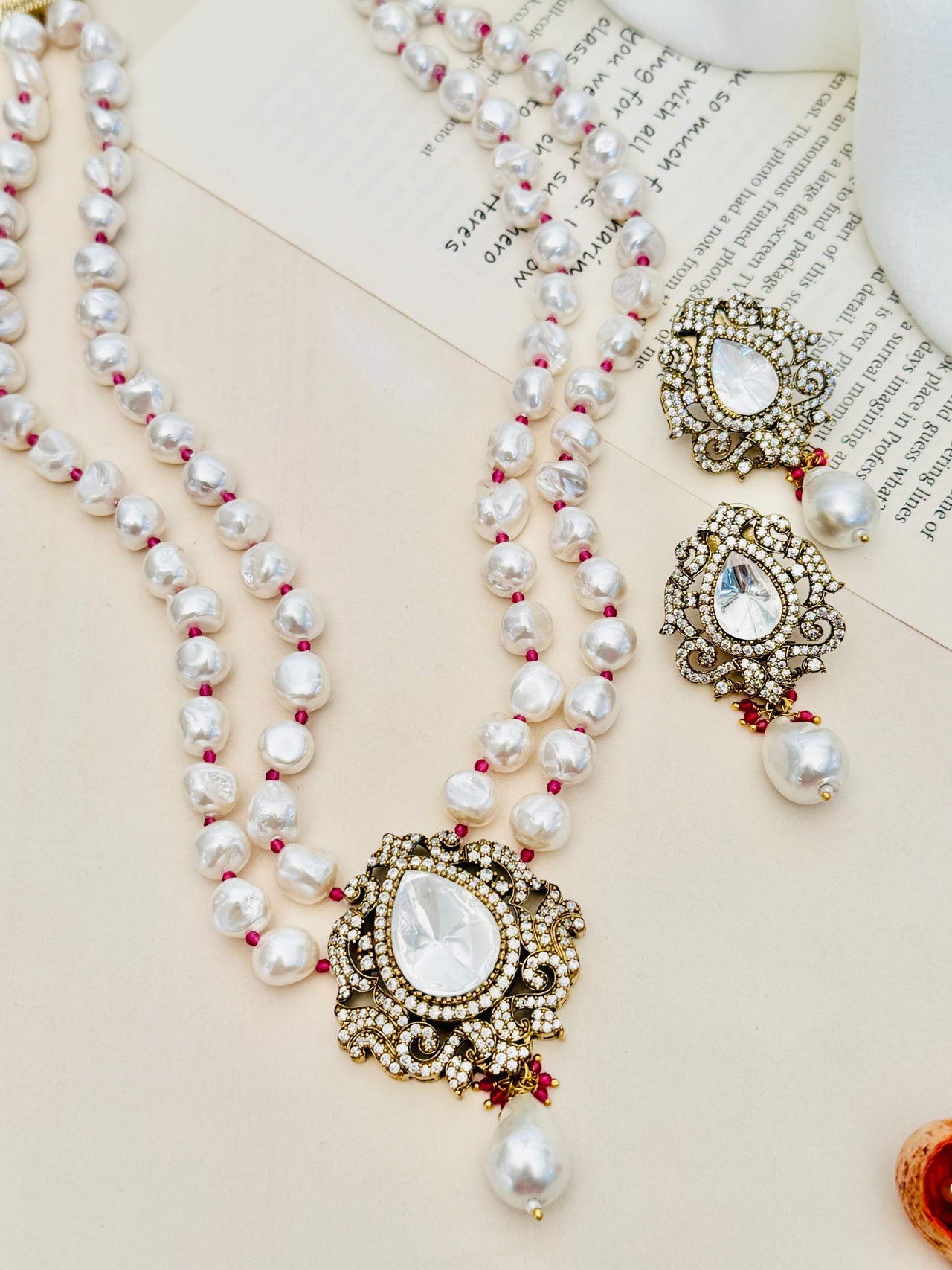 Heritage Fusion Polki Pearl Mala Set featuring double-strand pearls with intricate gold and polki pendant and matching earrings