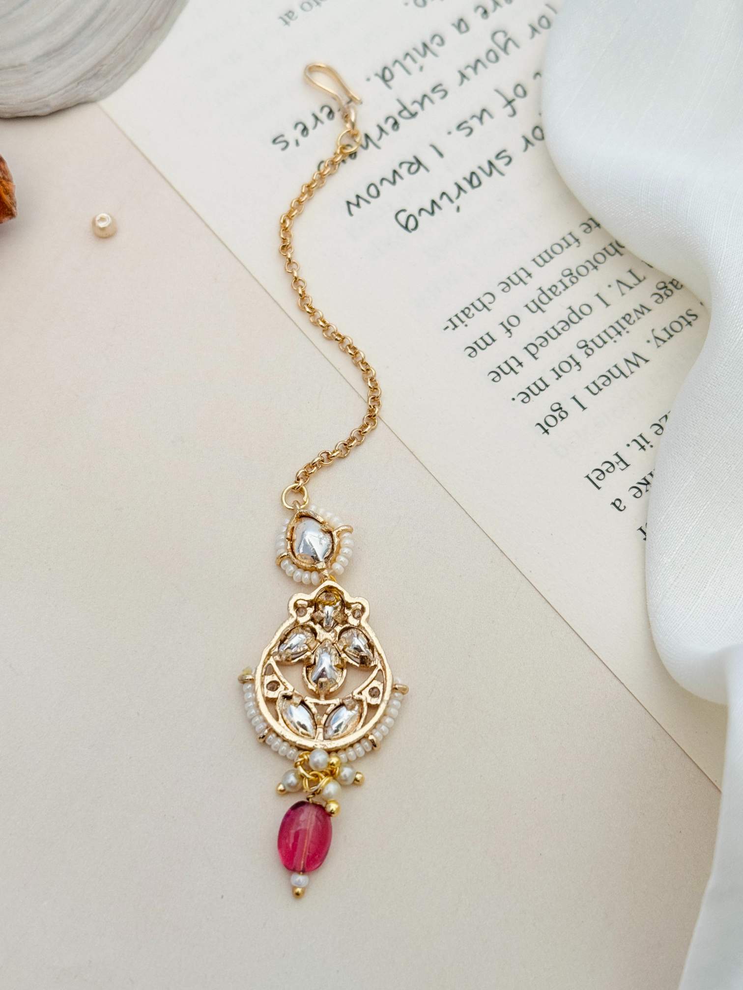 High Quality Bold Gold Plated Kundan Maangtikka with intricate design and pink bead from Abdesignsjewellery