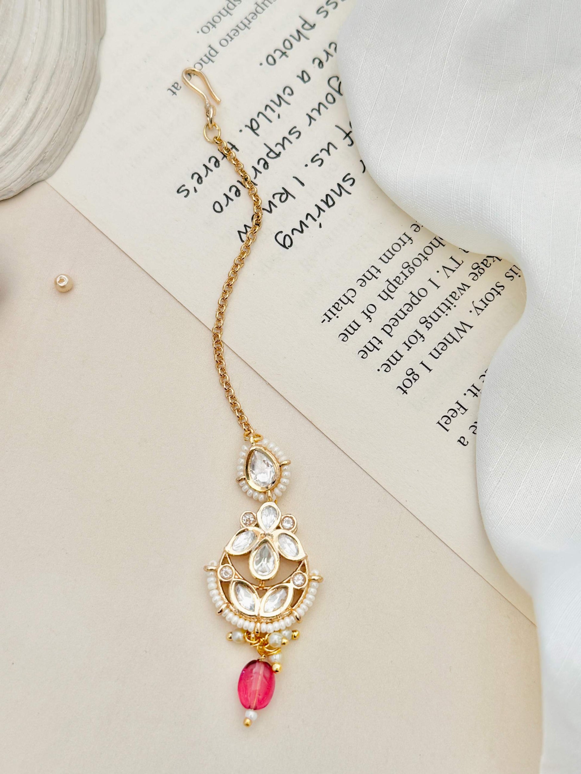 High Quality Bold Gold Plated Kundan Maangtikka with white stones and pink bead hanging from gold chain