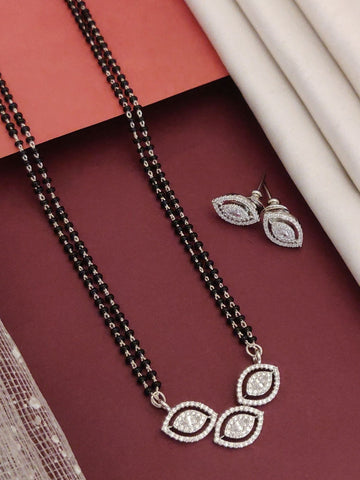 Elegant affordable mangalsutra set with silver accents and matching earrings on a maroon background