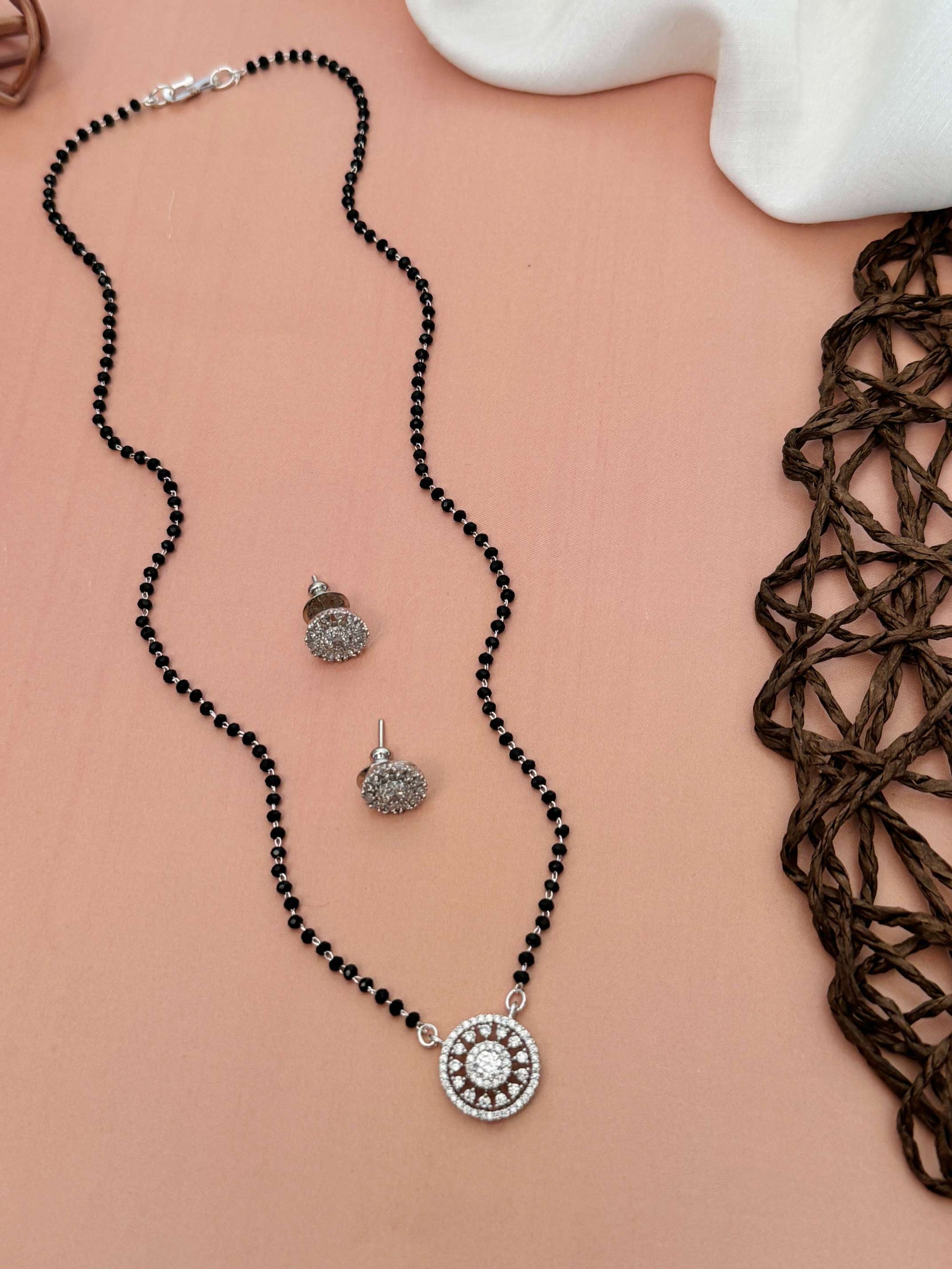 American Diamond Mangalsutra Set with black beads and round diamond pendant by Abdesignsjewellery