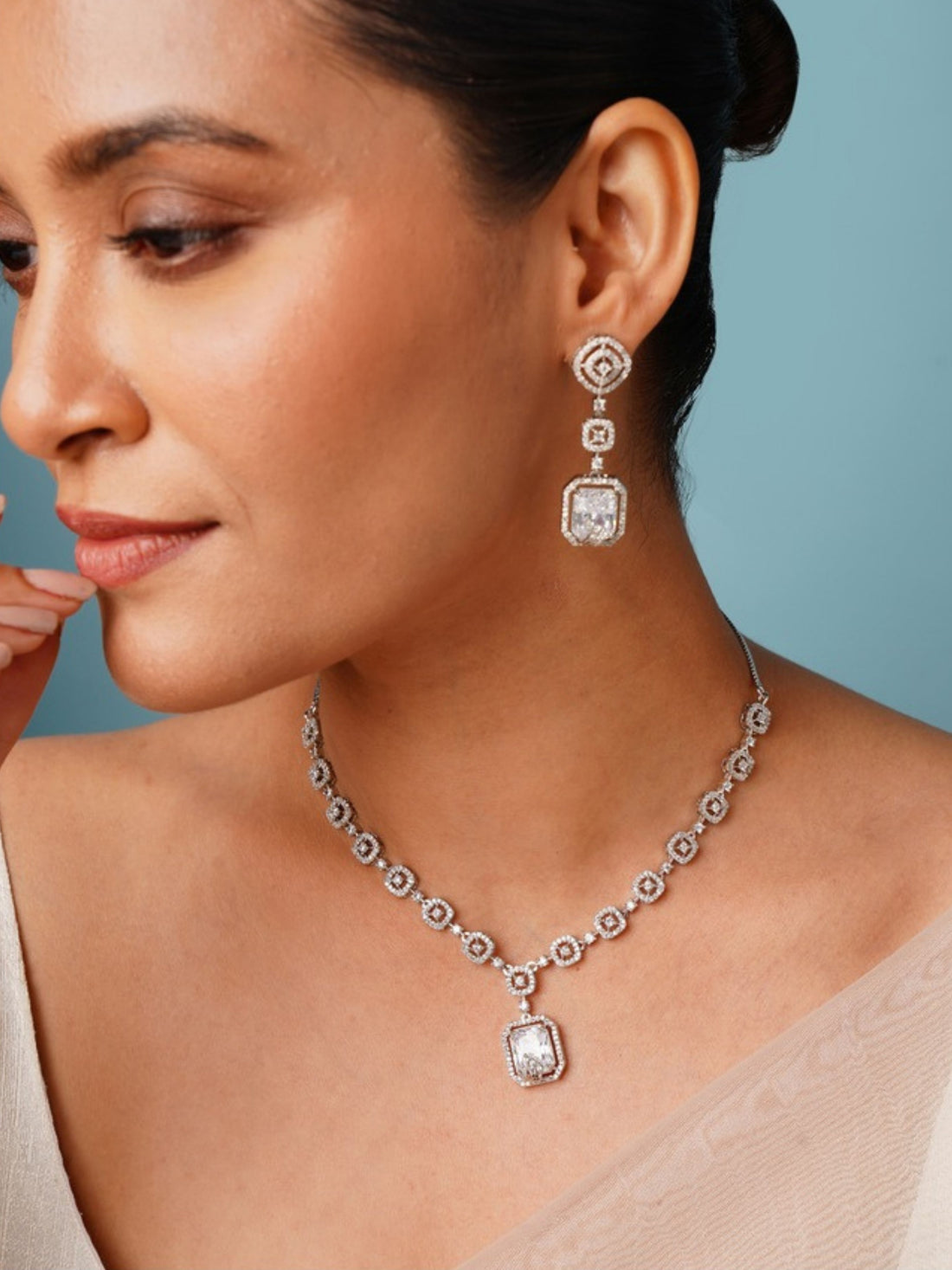 Abdesignsjewellery American Diamond Necklace Set featuring intricate pendant and matching earrings worn by model